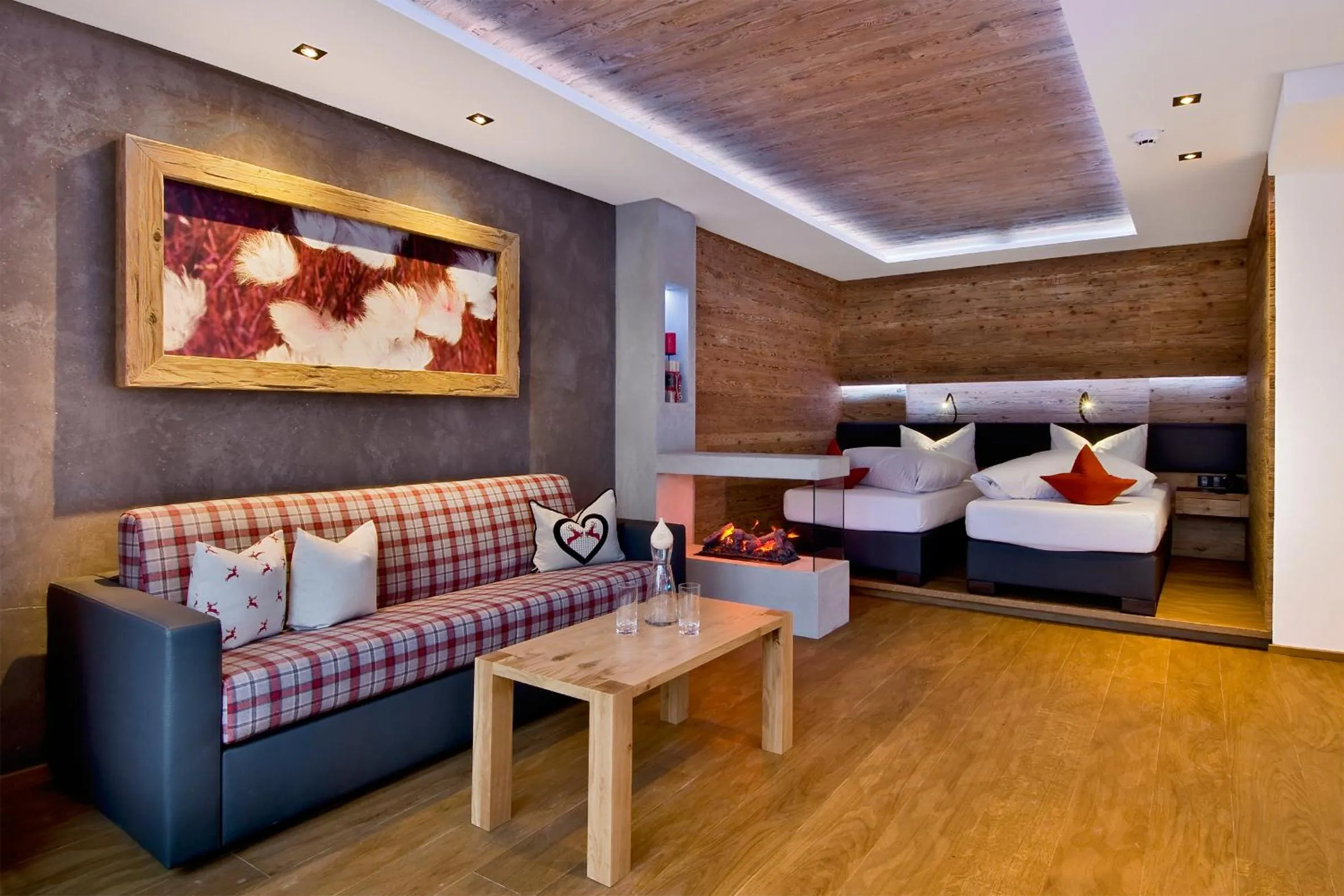 Living room, Bed in PETE Alpine Boutique Hotel - klein und fein - Private SPA Suiten und Zimmer