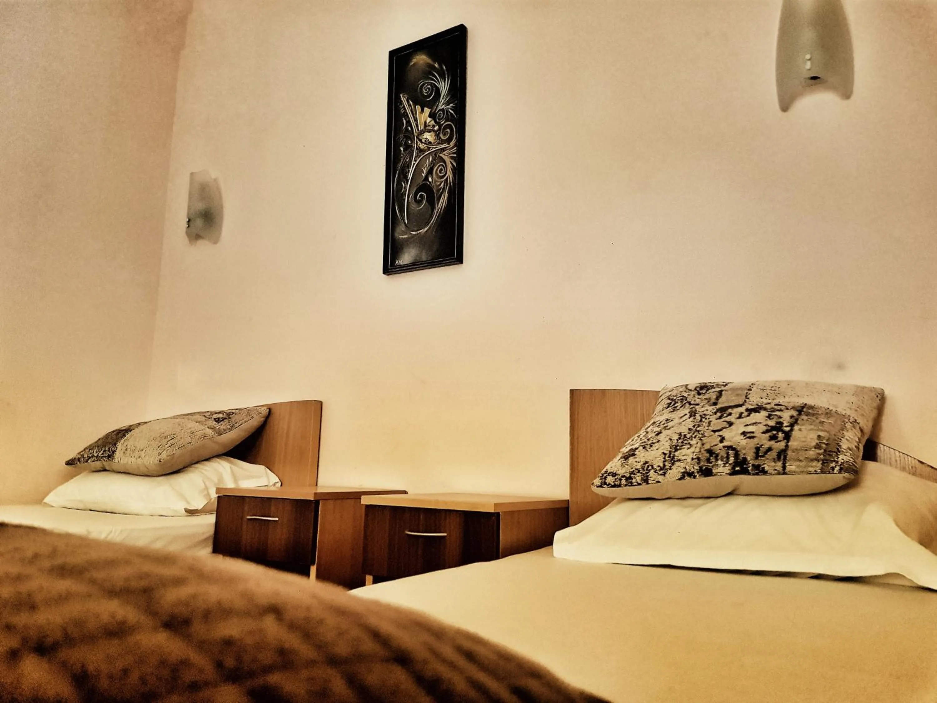 Bed in Discret Hotel & Restaurant