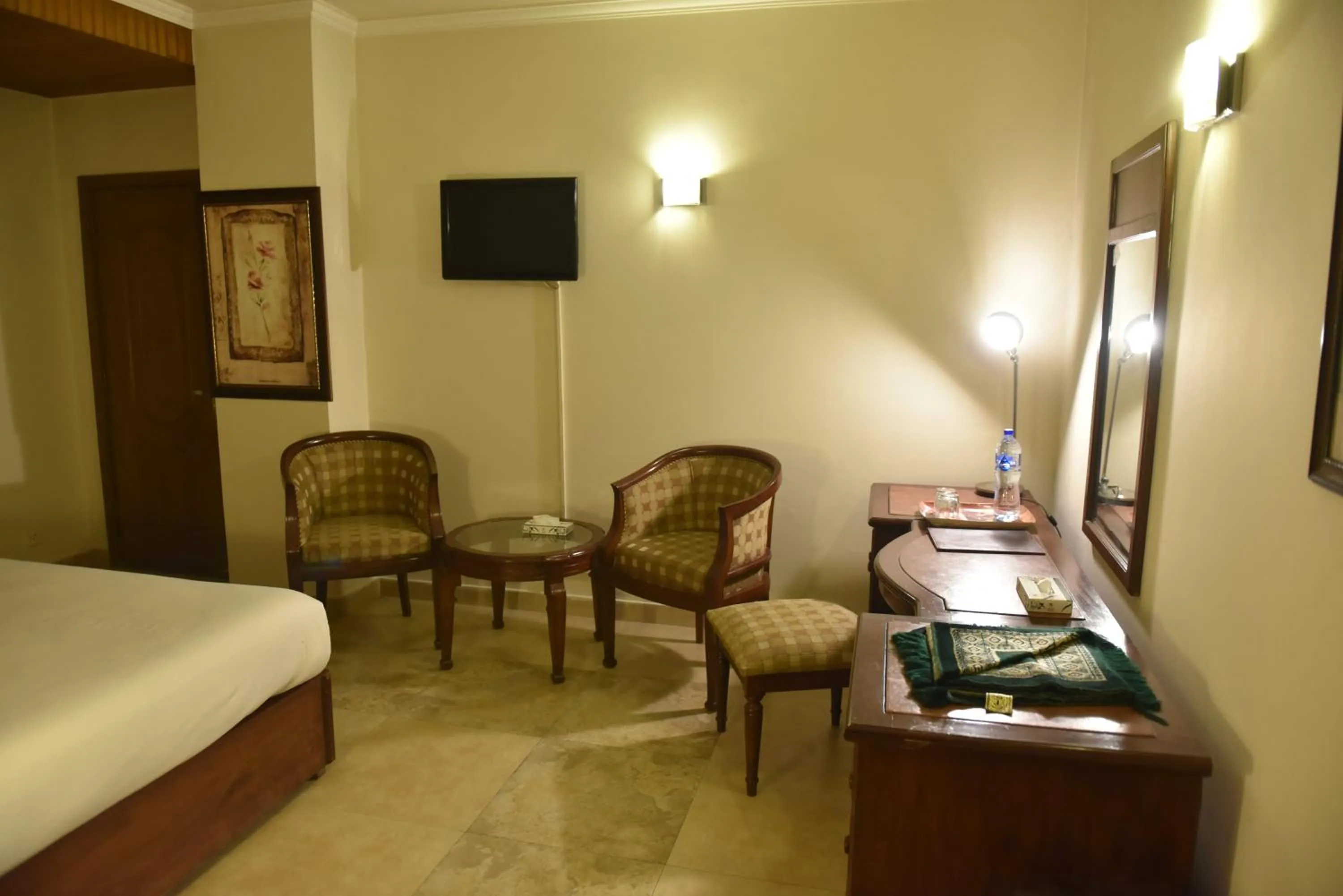 Bed in Shalimar Tower Hotel Lahore