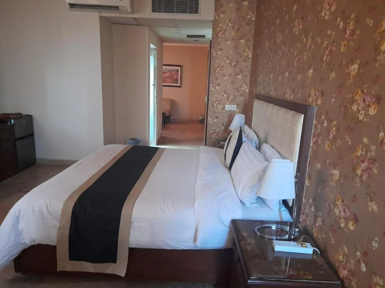 Bed in Shalimar Tower Hotel Lahore