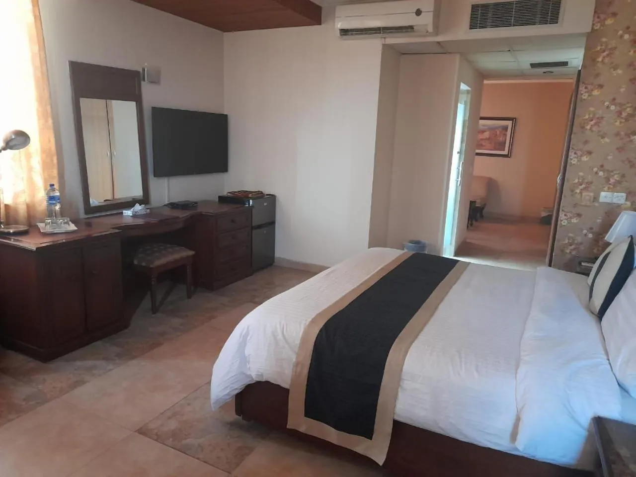 Bed in Shalimar Tower Hotel Lahore