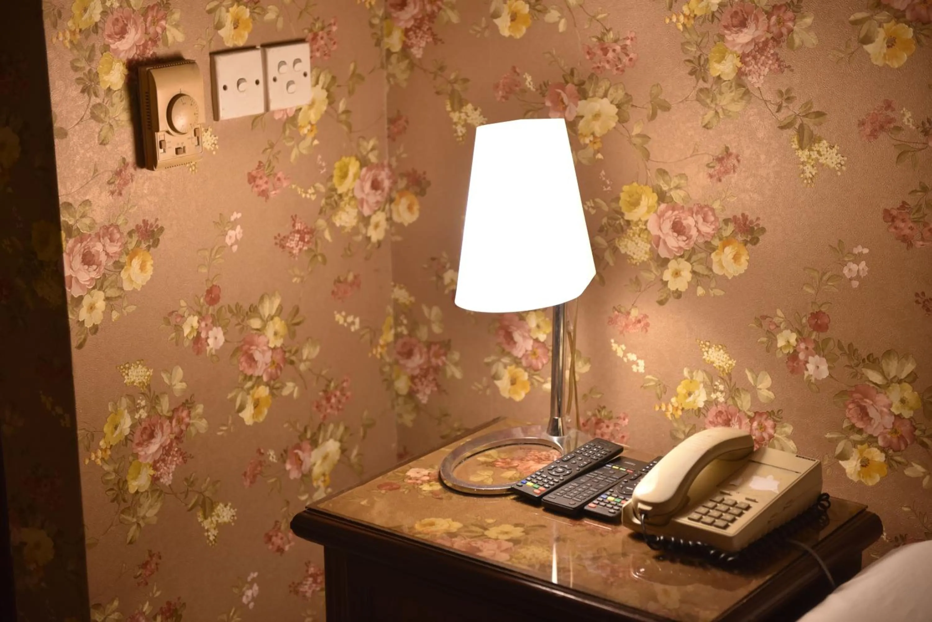 Bed in Shalimar Tower Hotel Lahore