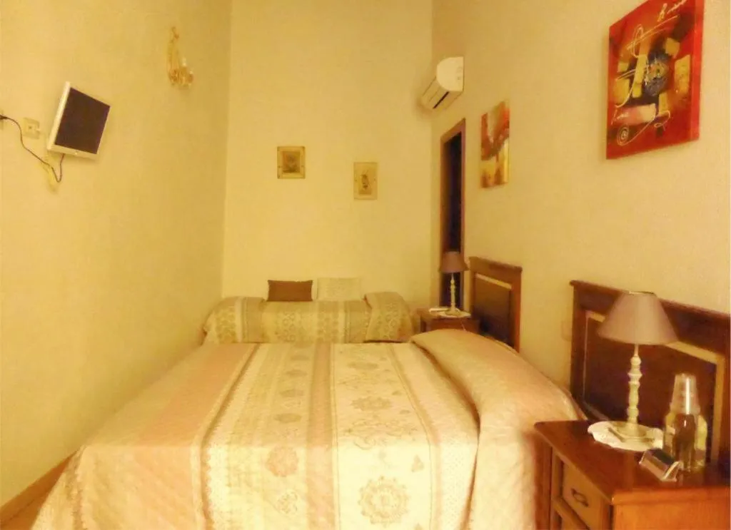 Bed in L'Antica Torre Caralis Holiday