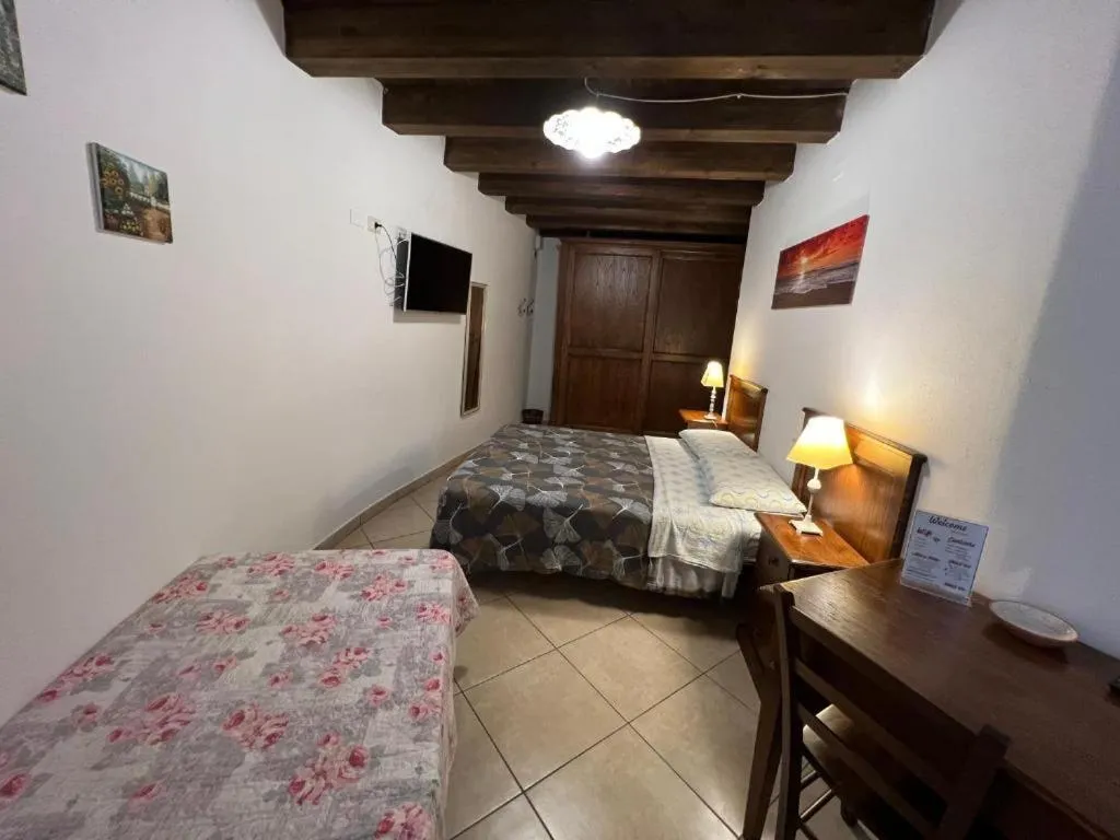 Bed in L'Antica Torre Caralis Holiday