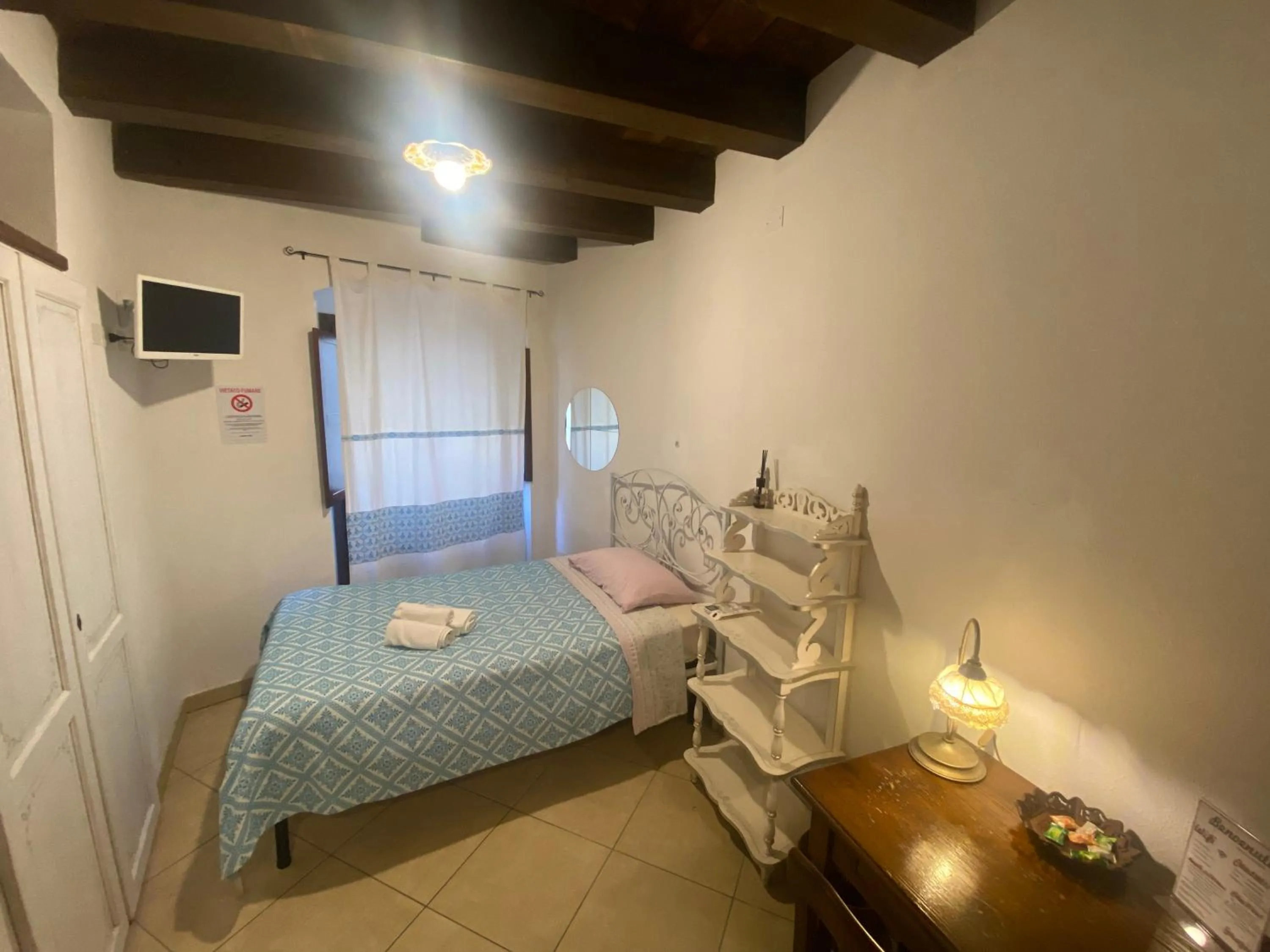 Bed in L'Antica Torre Caralis Holiday