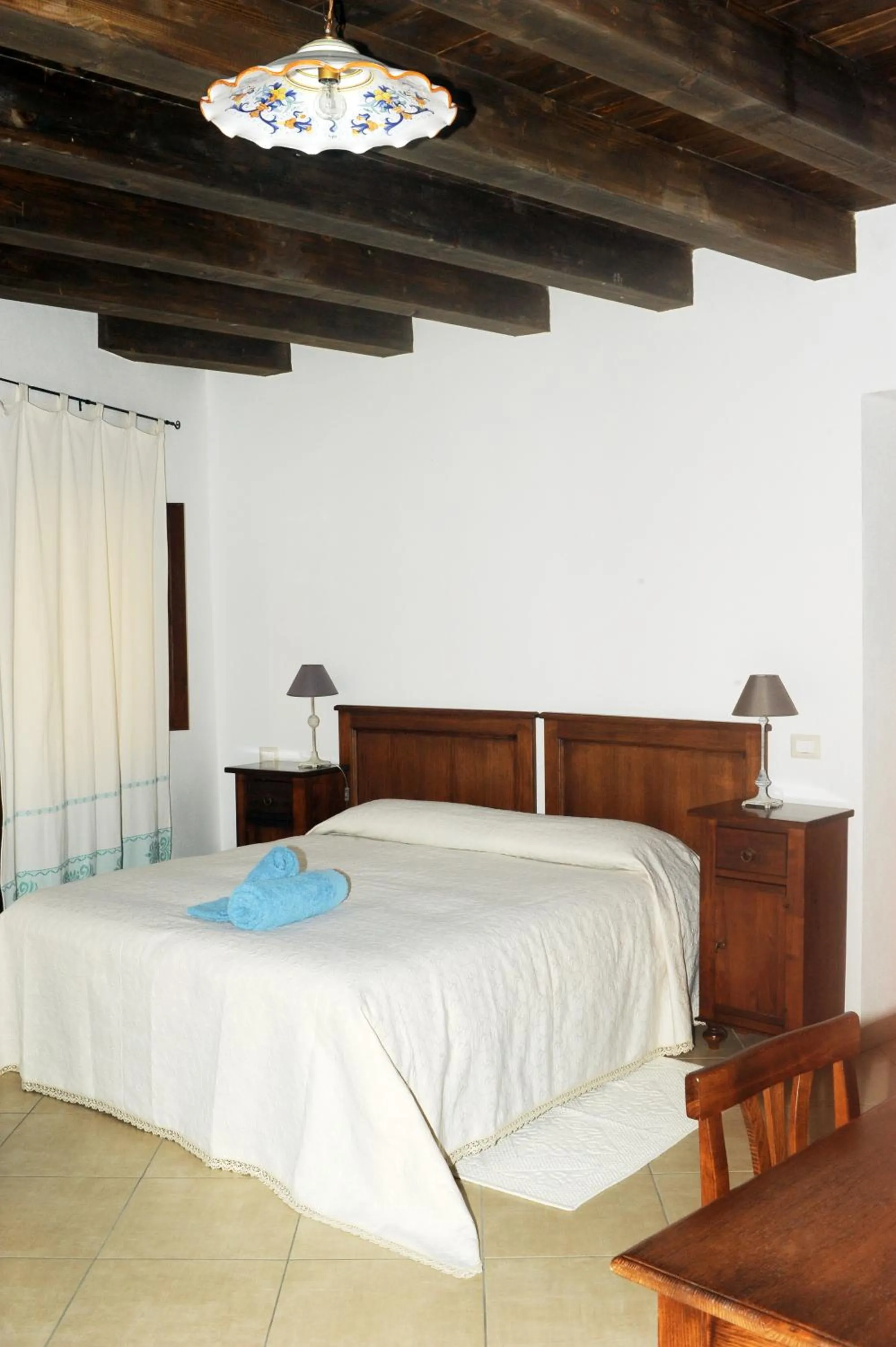 Decorative detail, Bed in L'Antica Torre Caralis Holiday