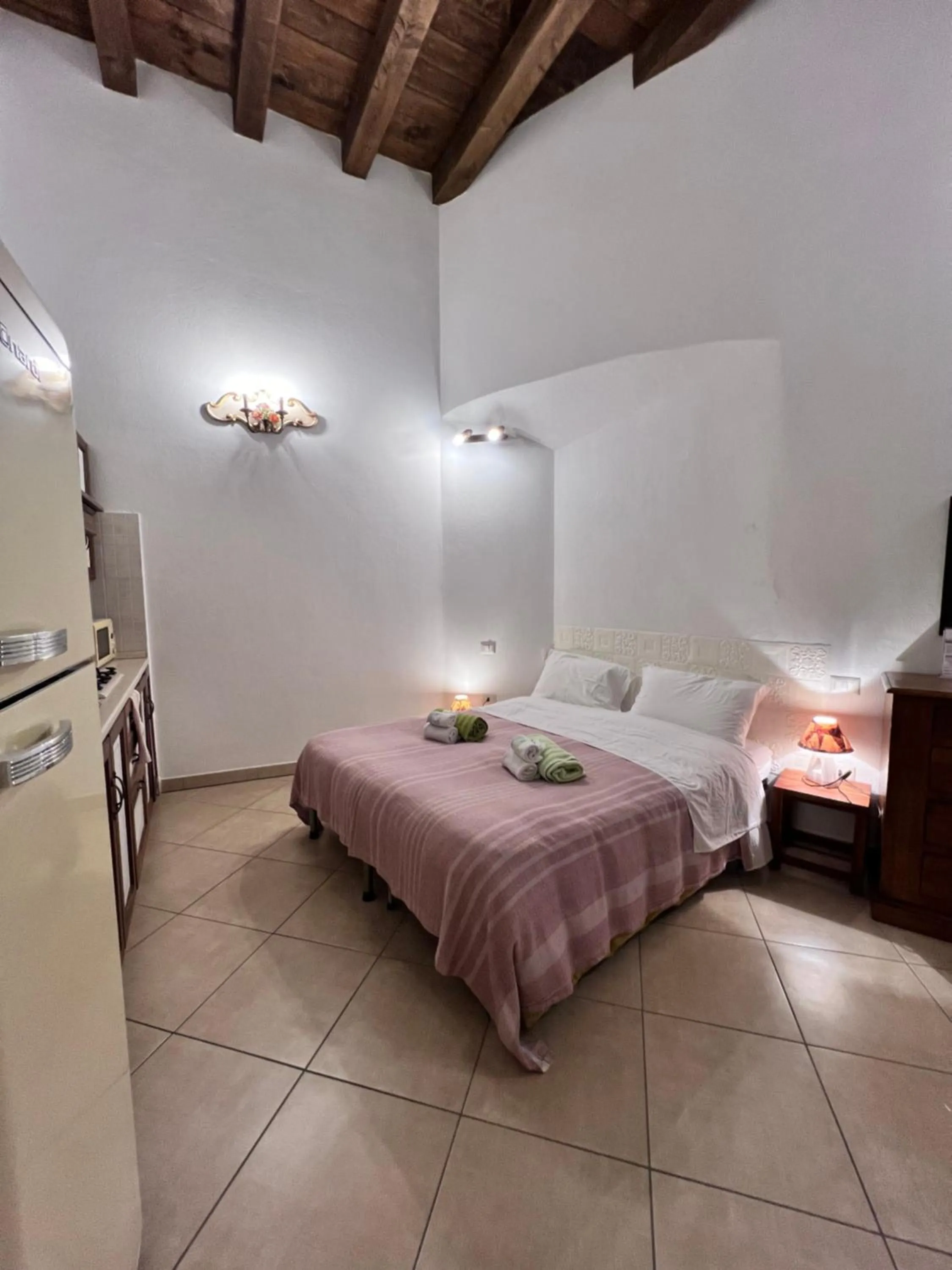 Bed in L'Antica Torre Caralis Holiday
