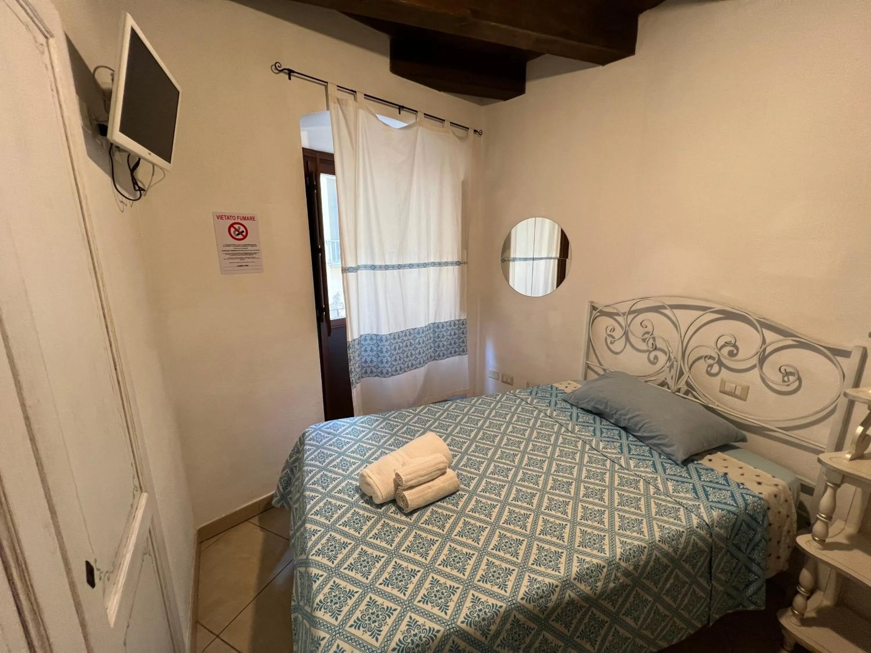 Bed in L'Antica Torre Caralis Holiday