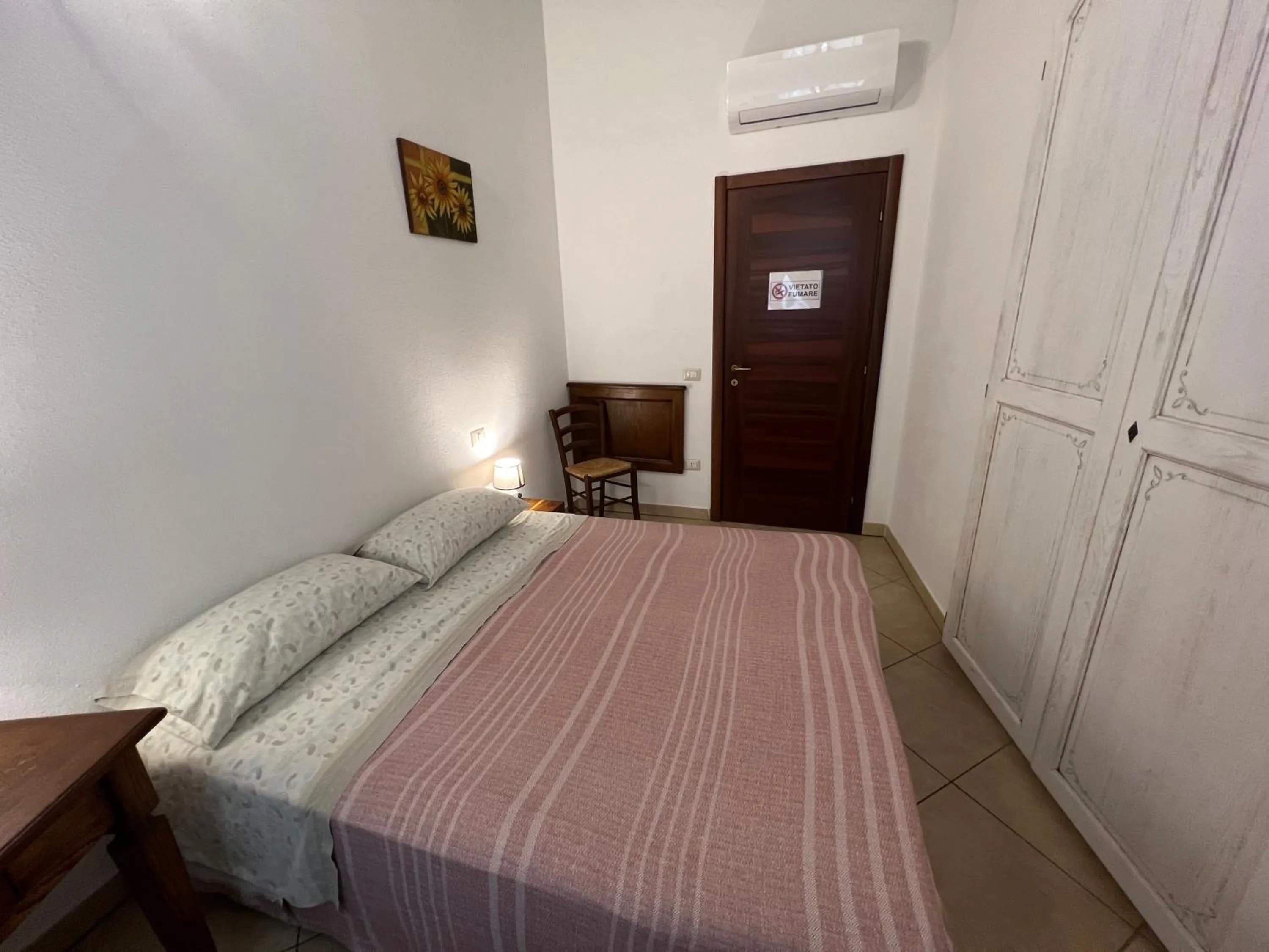 Bed in L'Antica Torre Caralis Holiday