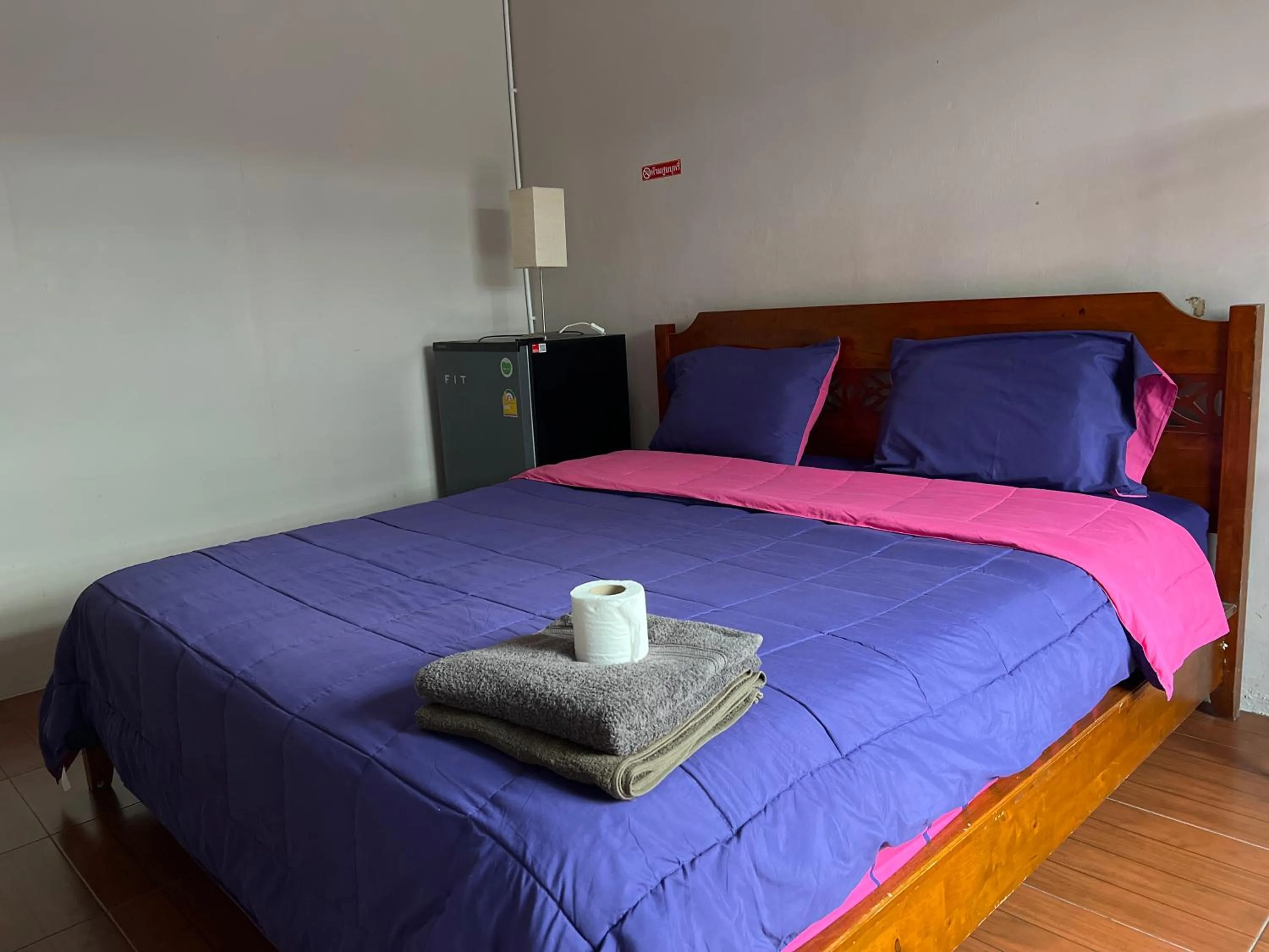 Bed in SMILE HOME GUESTHOUSE