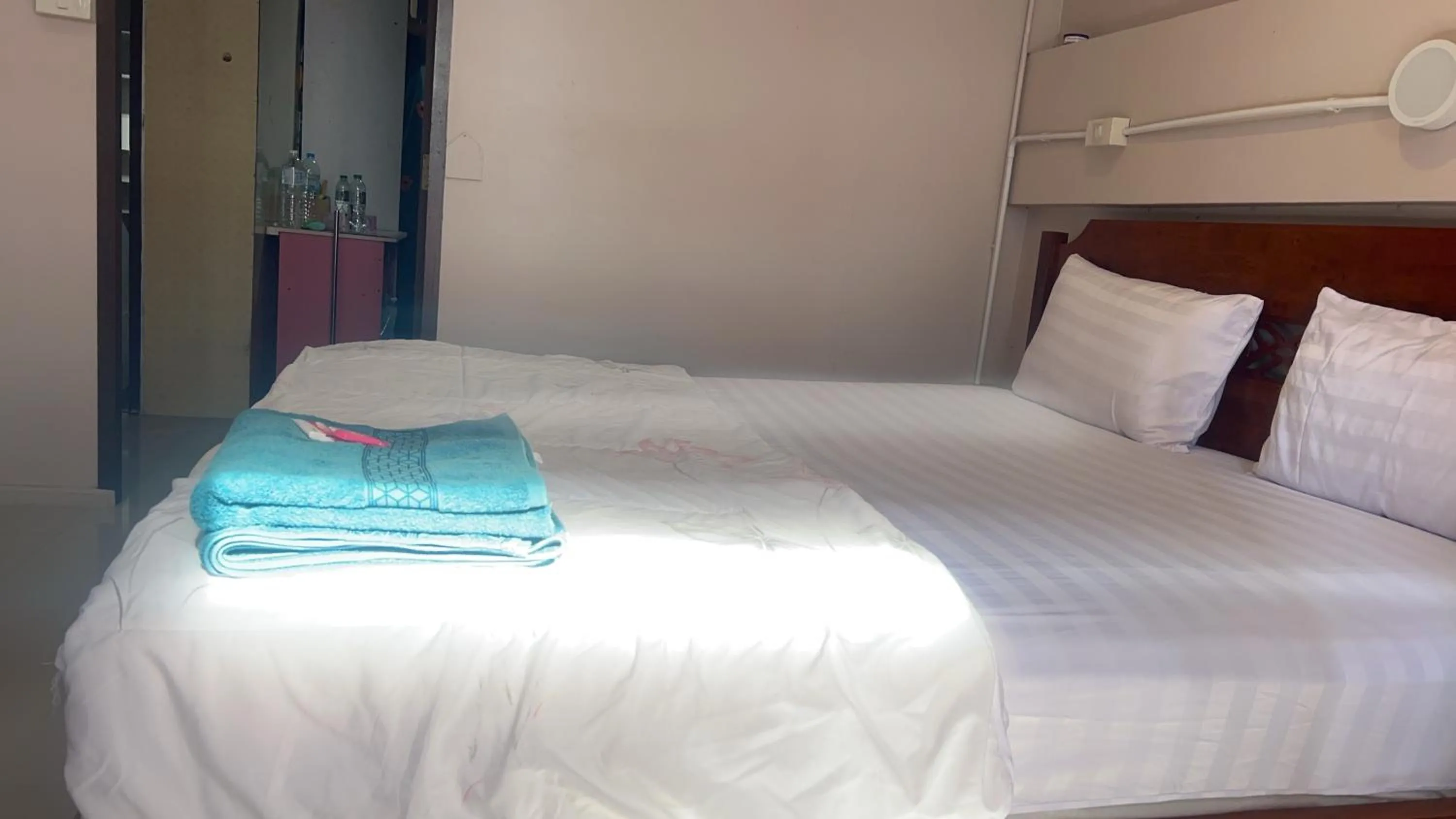 Bed in SMILE HOME GUESTHOUSE