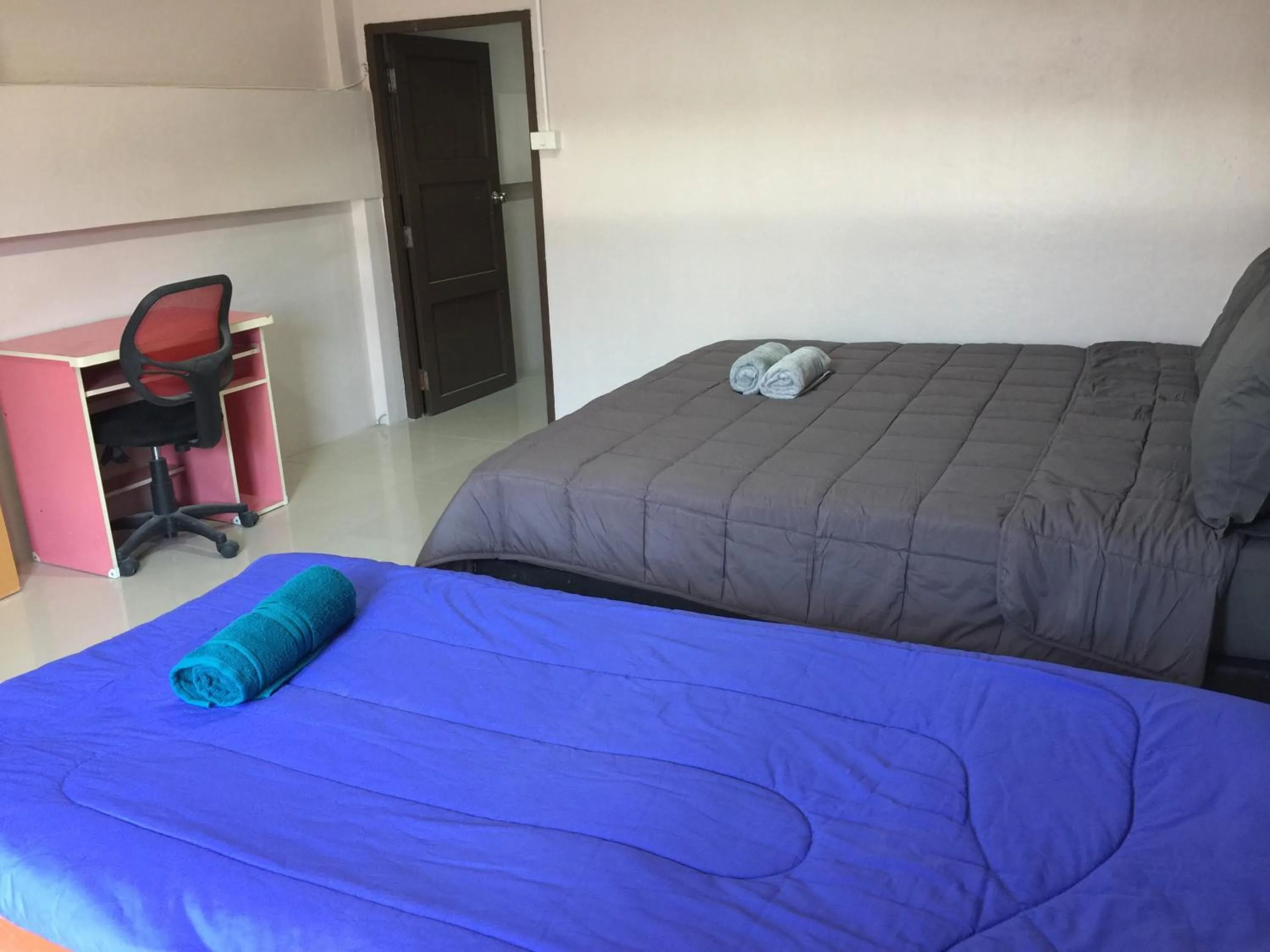 Bed in SMILE HOME GUESTHOUSE