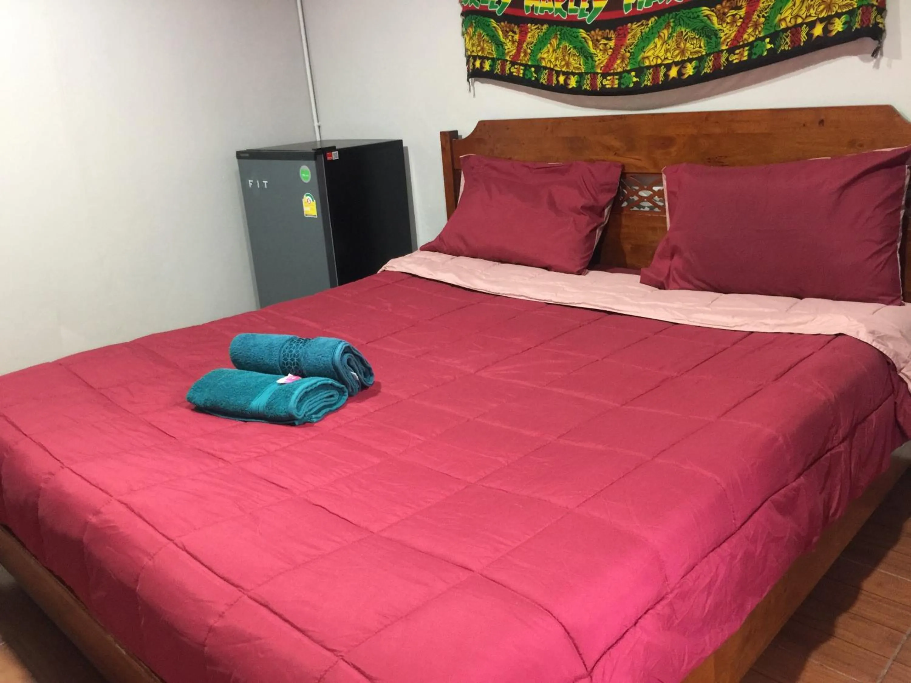 Bed in SMILE HOME GUESTHOUSE