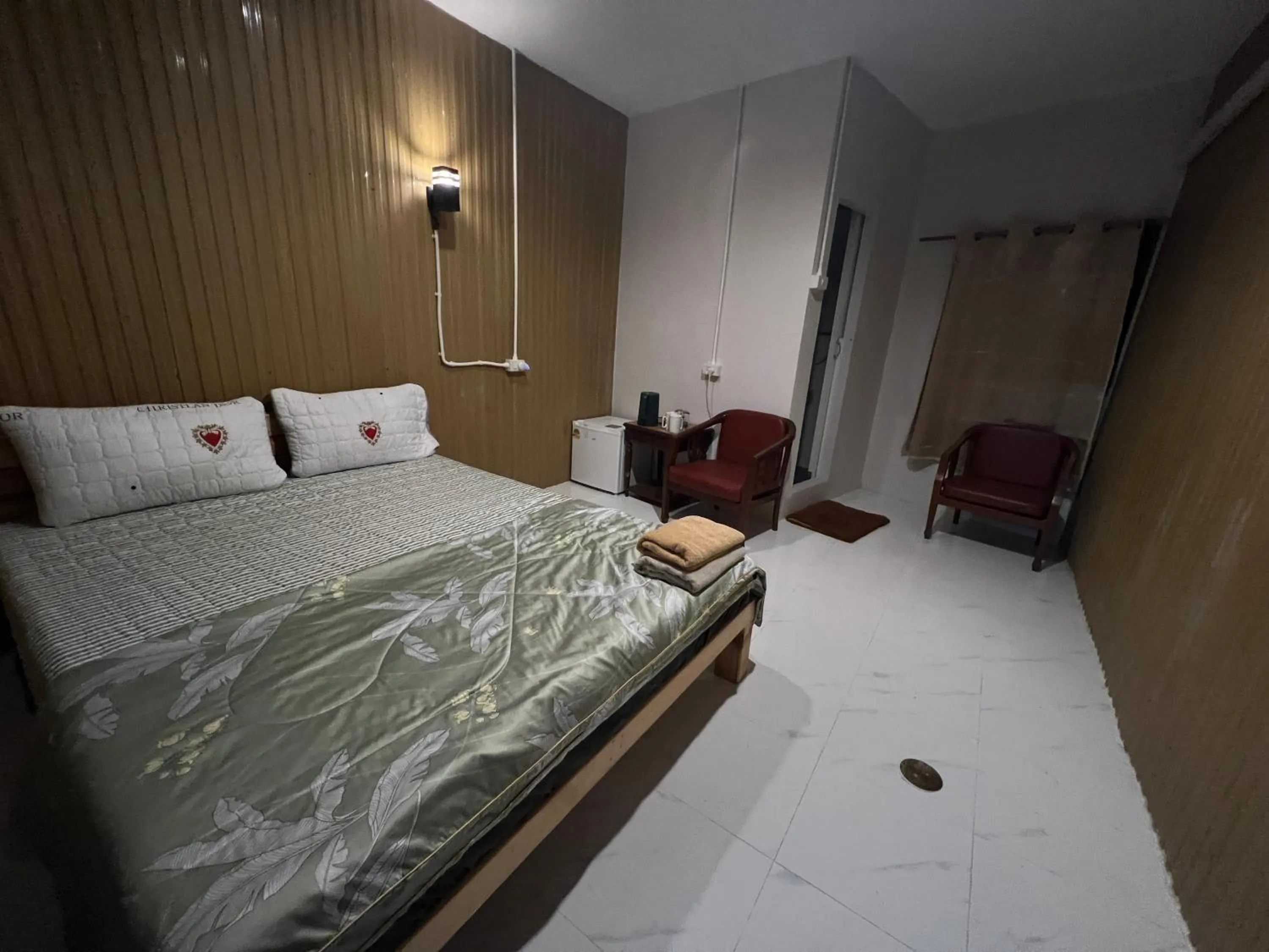 Bed in SMILE HOME GUESTHOUSE