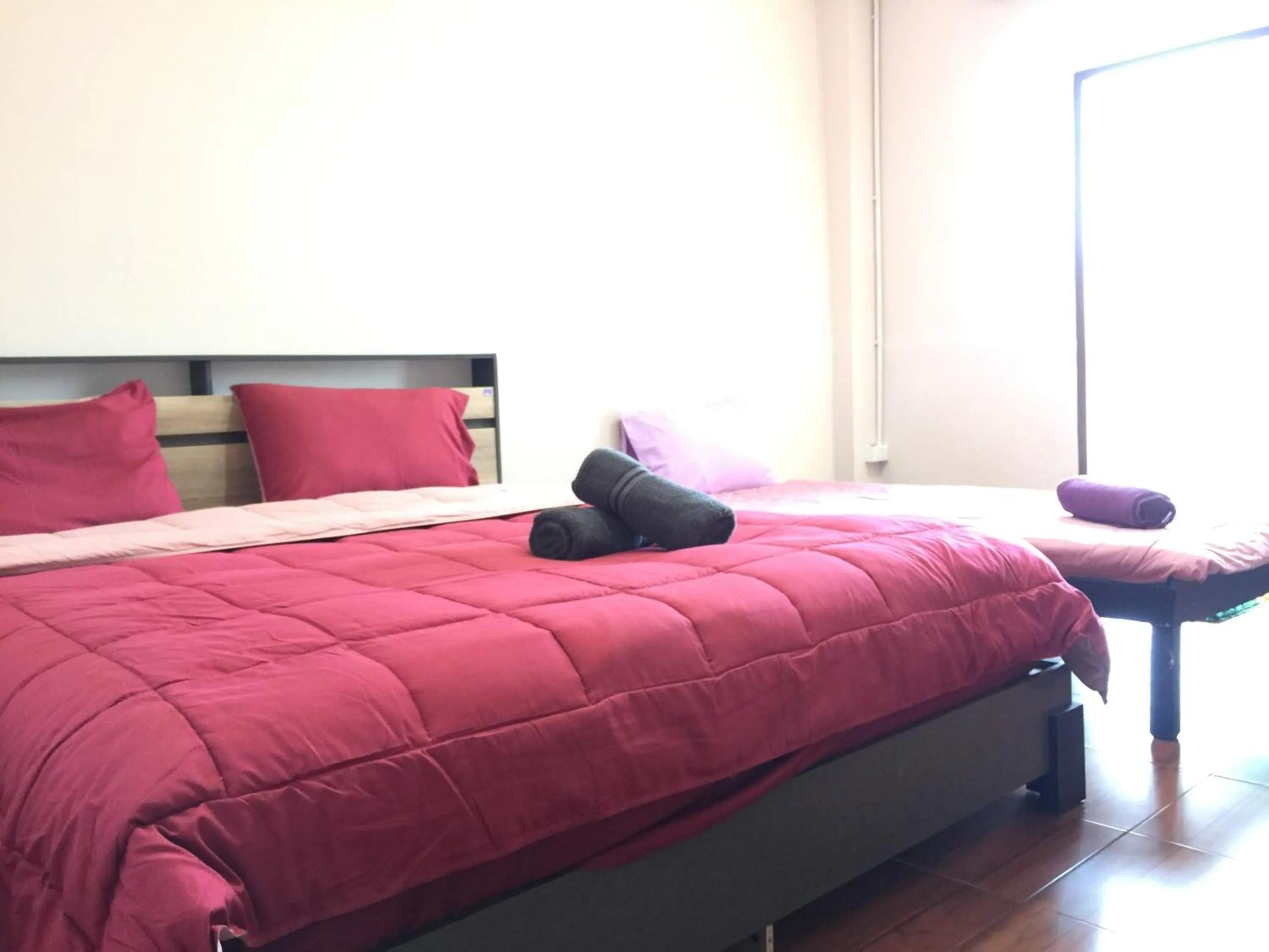 Bed in SMILE HOME GUESTHOUSE