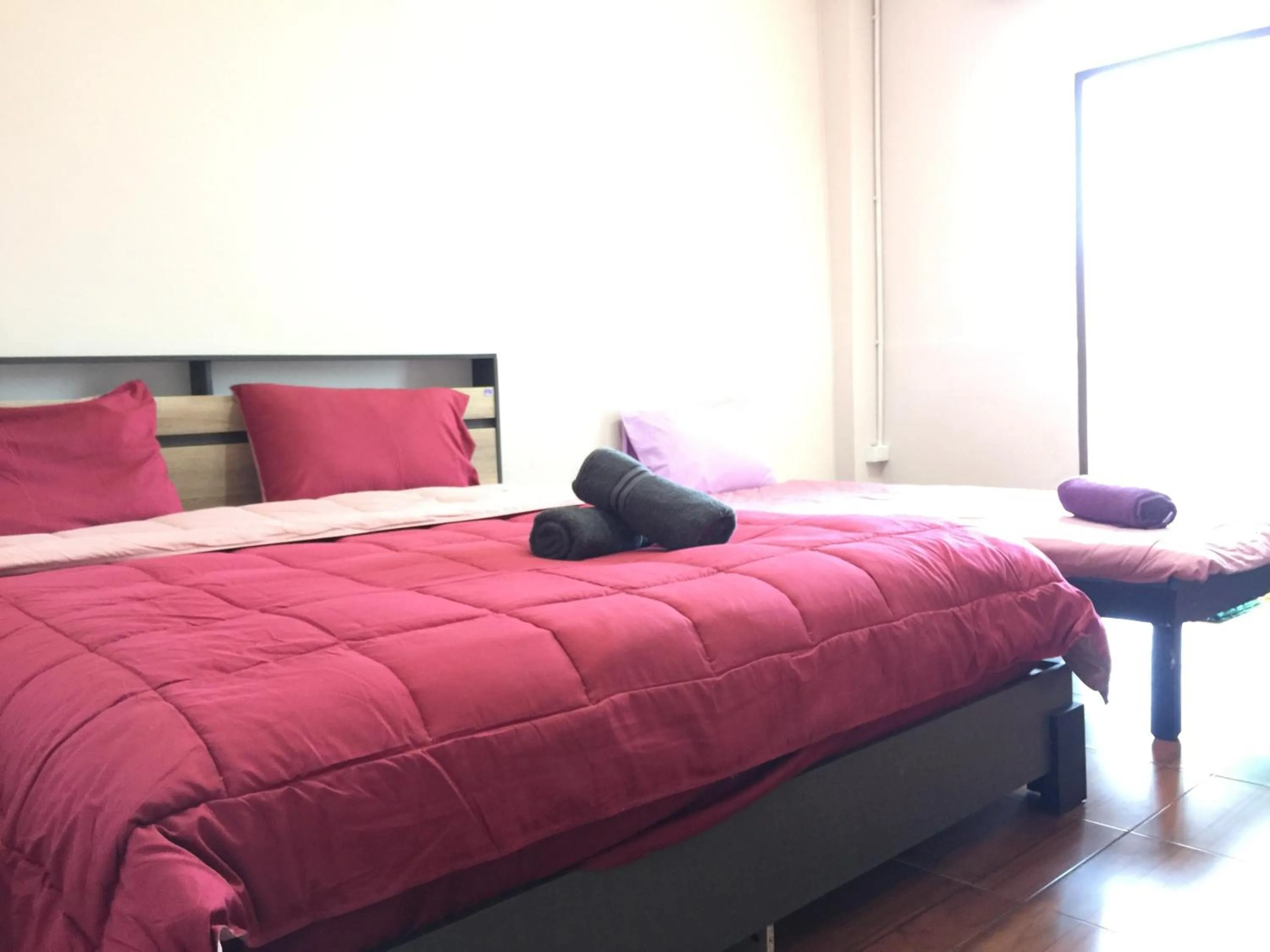 Bed in SMILE HOME GUESTHOUSE