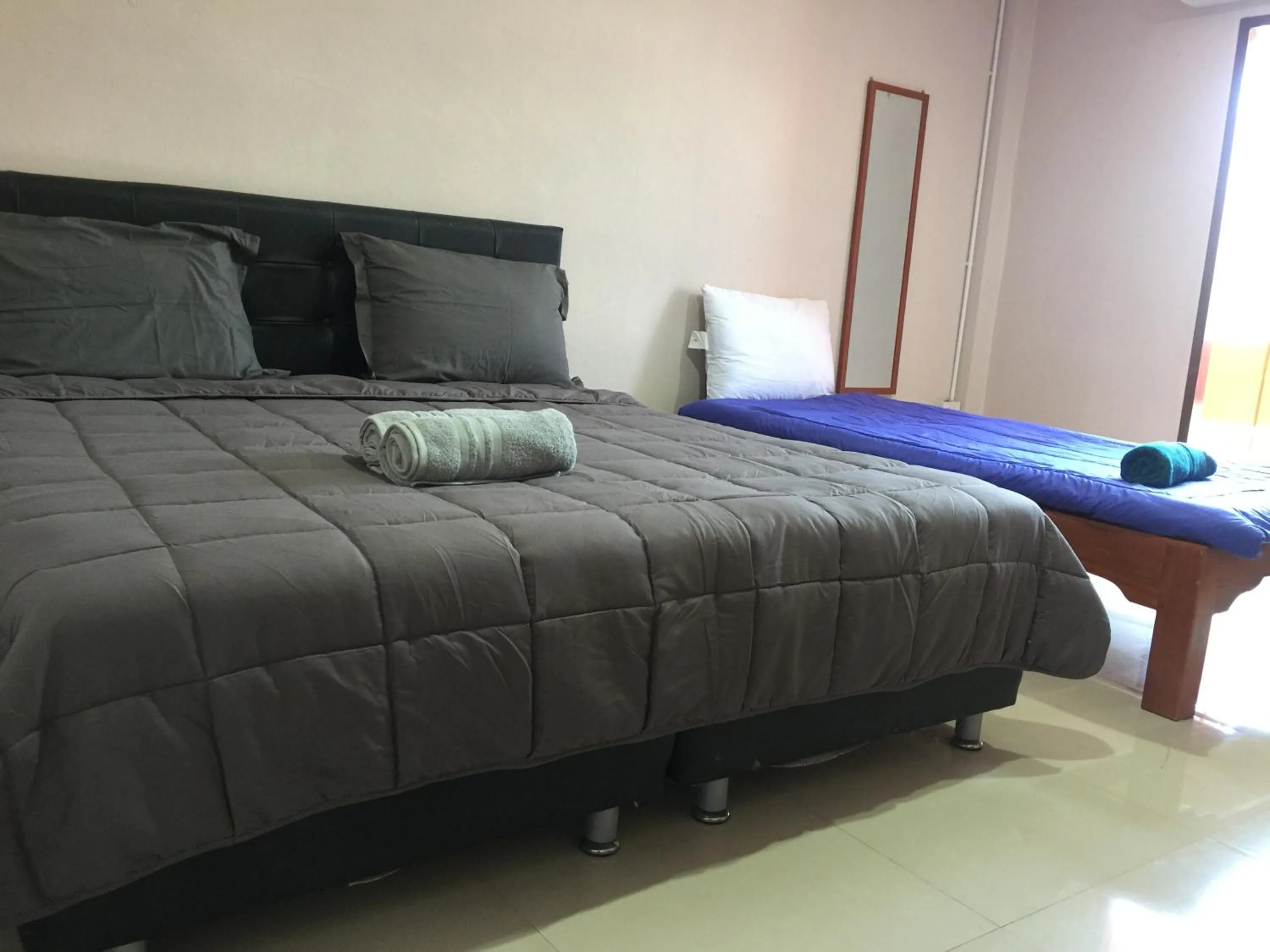 Bed in SMILE HOME GUESTHOUSE