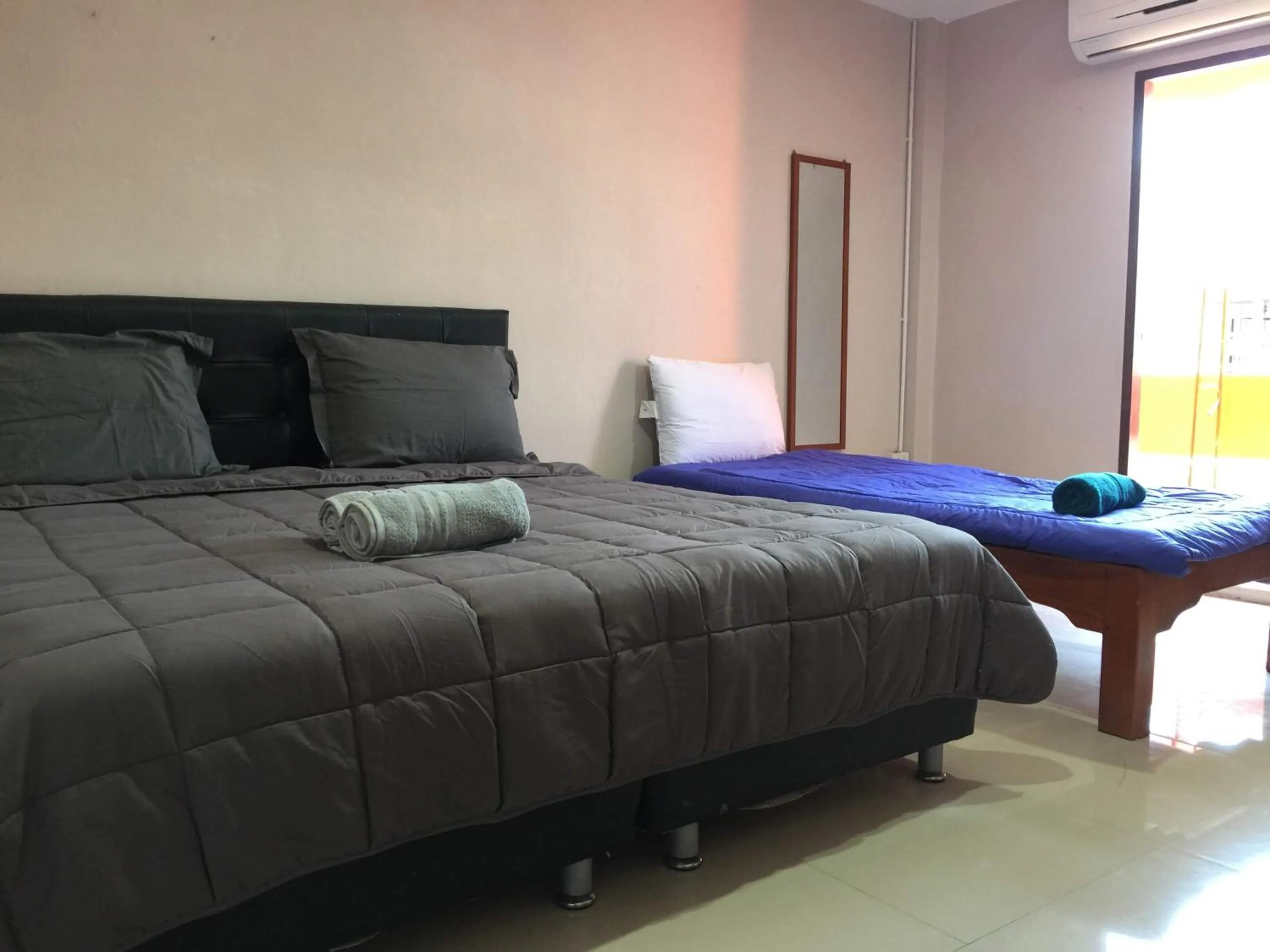 Bed in SMILE HOME GUESTHOUSE