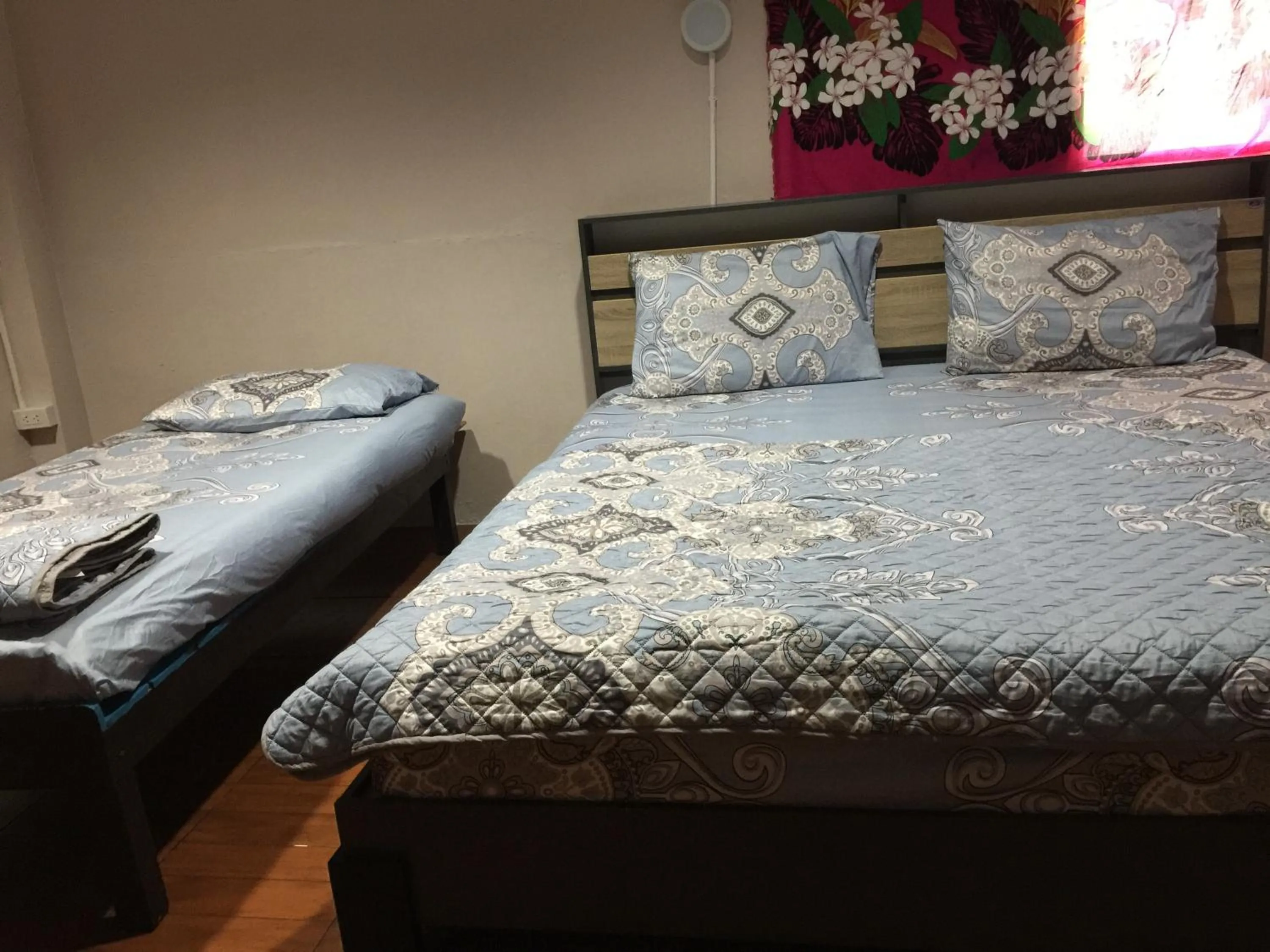 Bed in SMILE HOME GUESTHOUSE