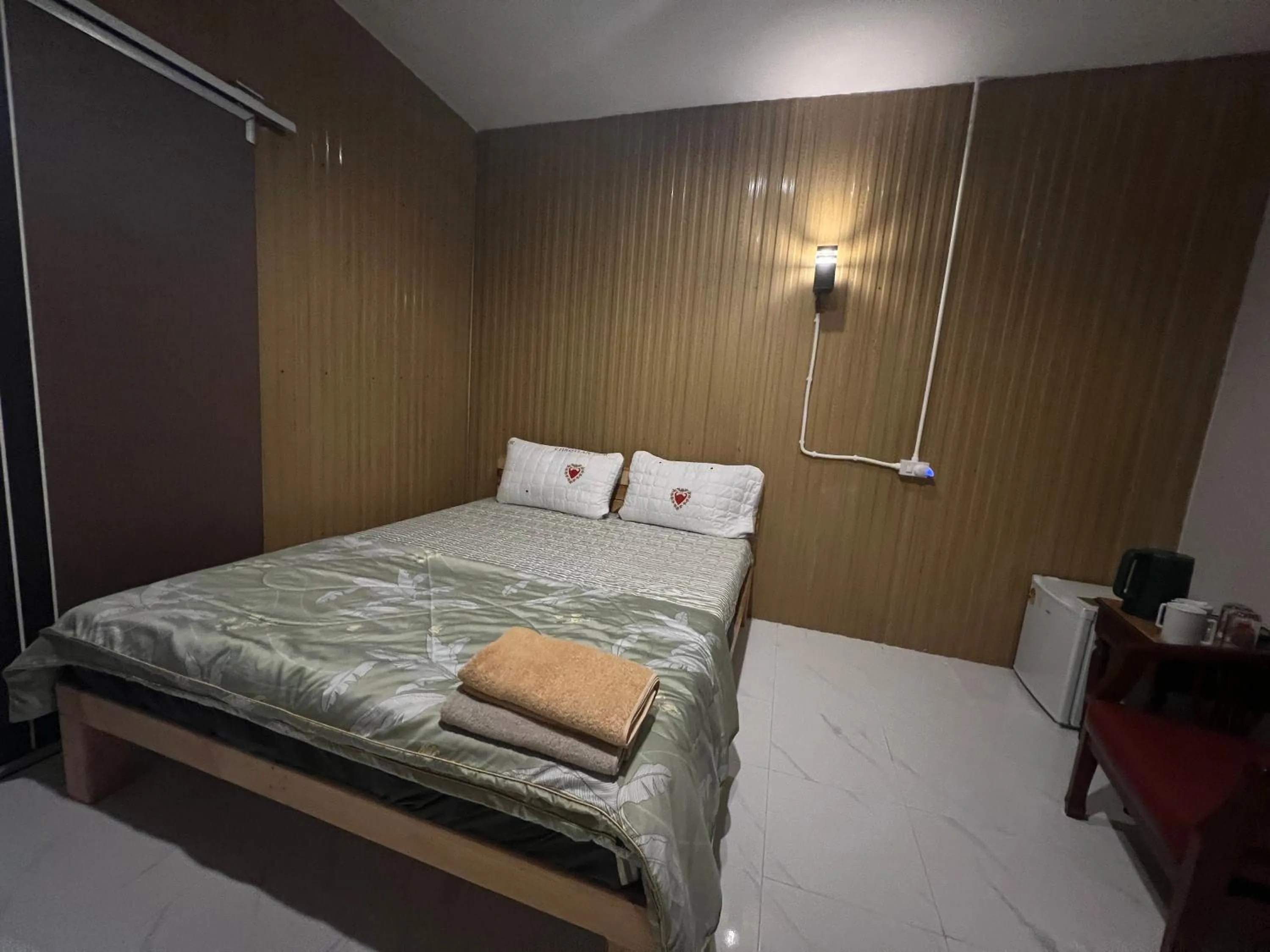 Bed in SMILE HOME GUESTHOUSE