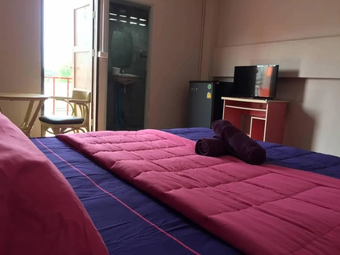 Bed in SMILE HOME GUESTHOUSE