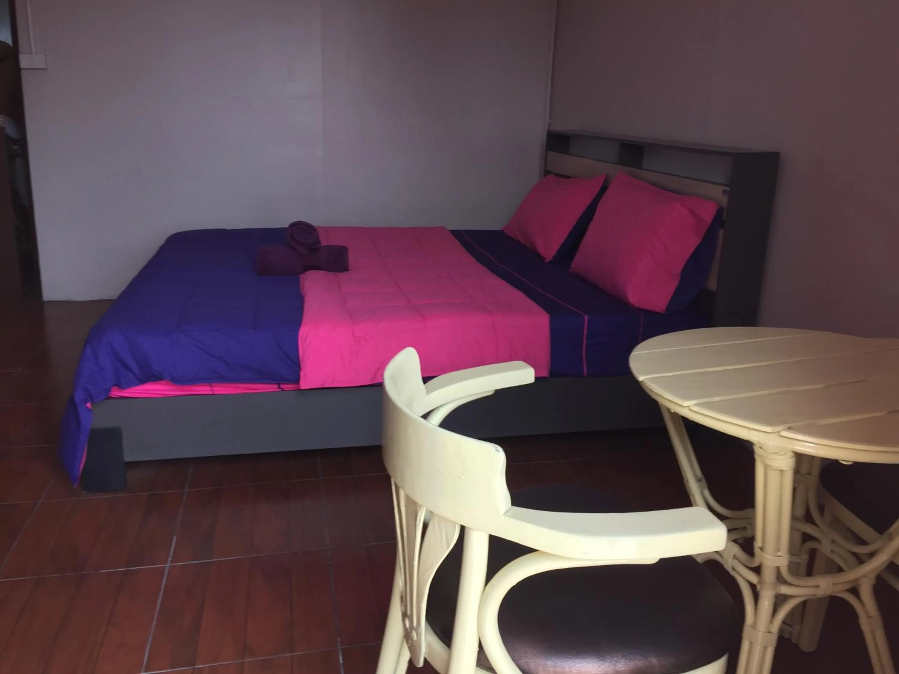 Bed in SMILE HOME GUESTHOUSE