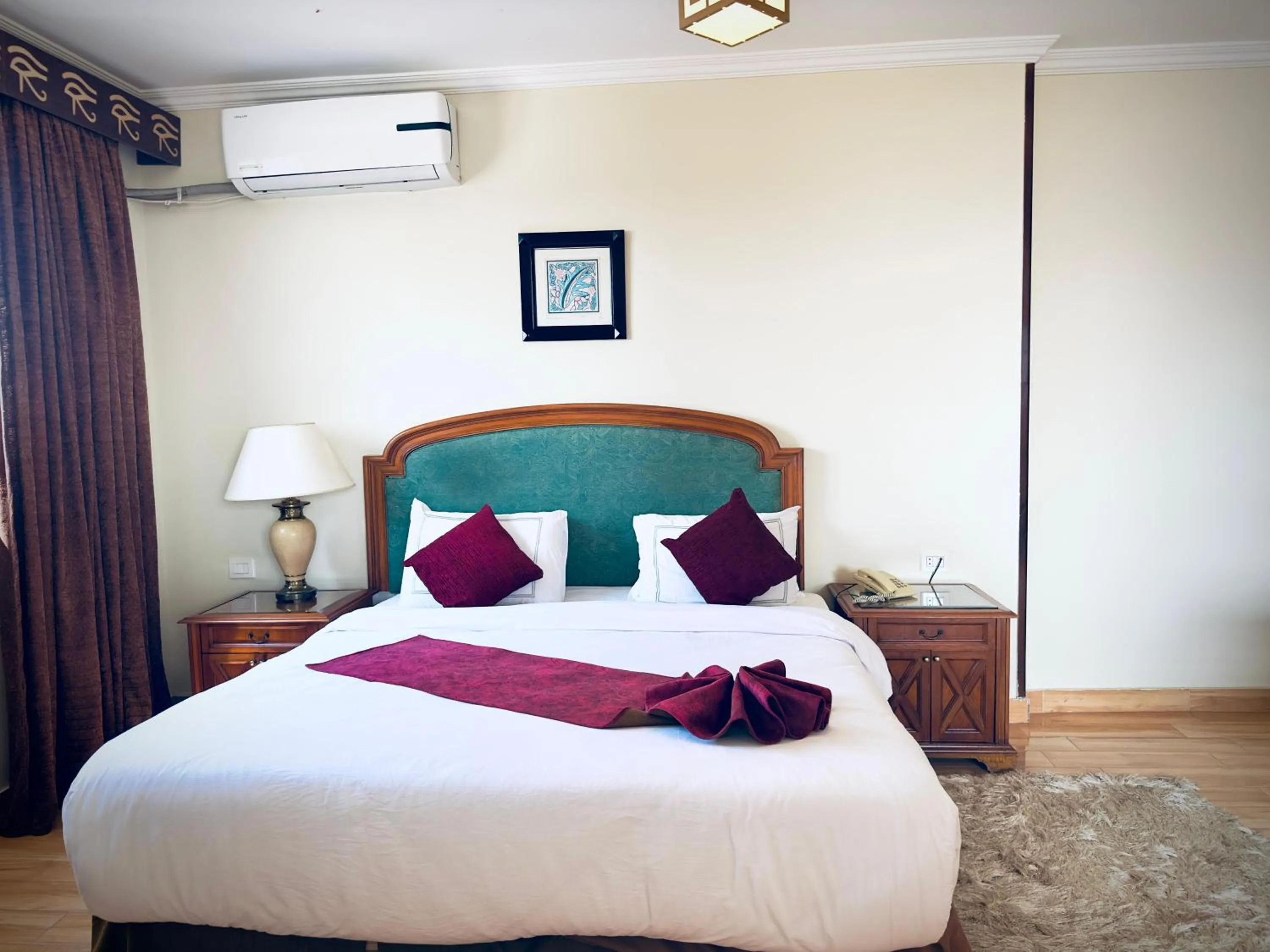 Bed in PYRAMIDS TOWER Inn