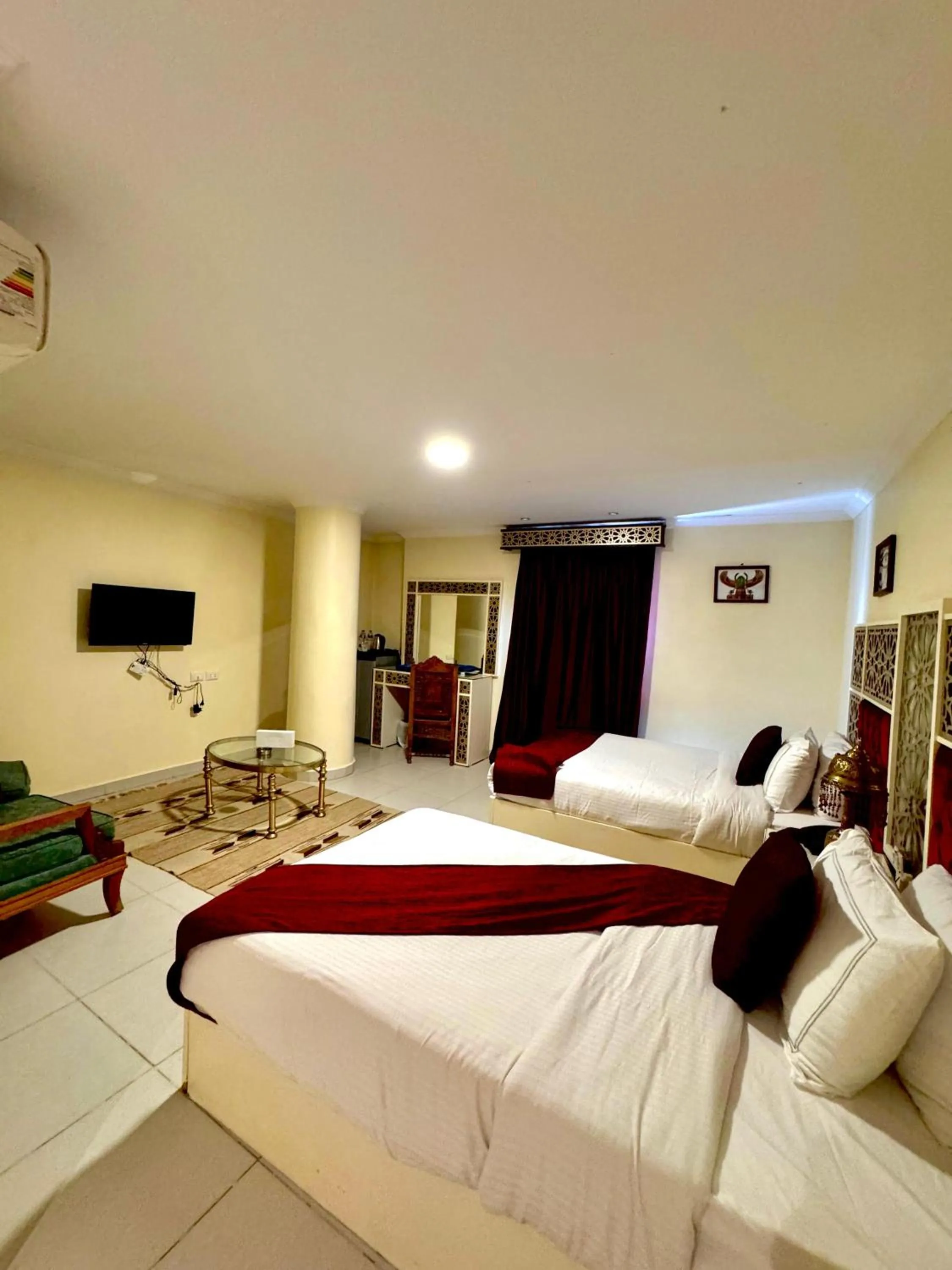 Communal lounge/ TV room, Bed in PYRAMIDS TOWER Inn