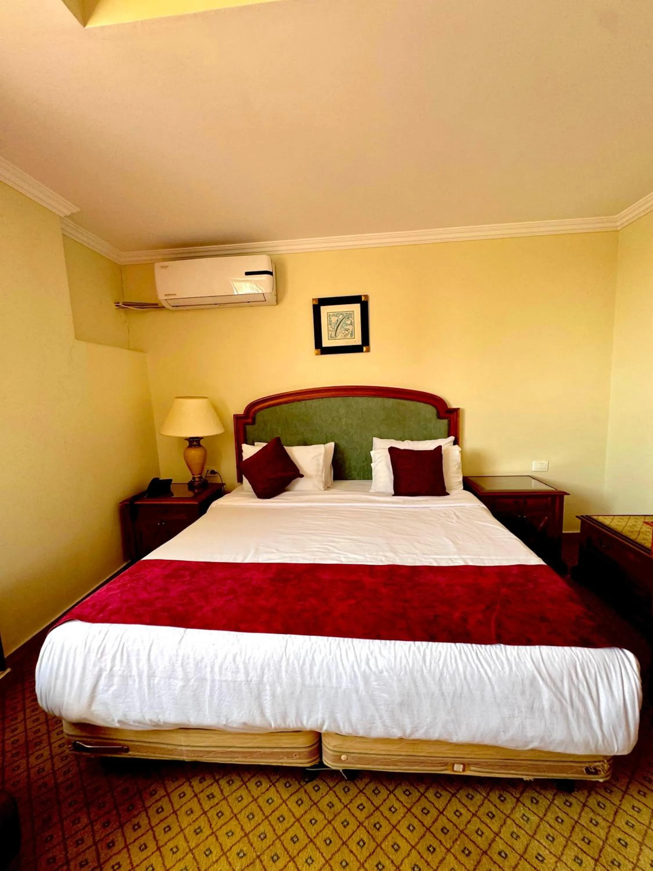 Bed in PYRAMIDS TOWER Inn