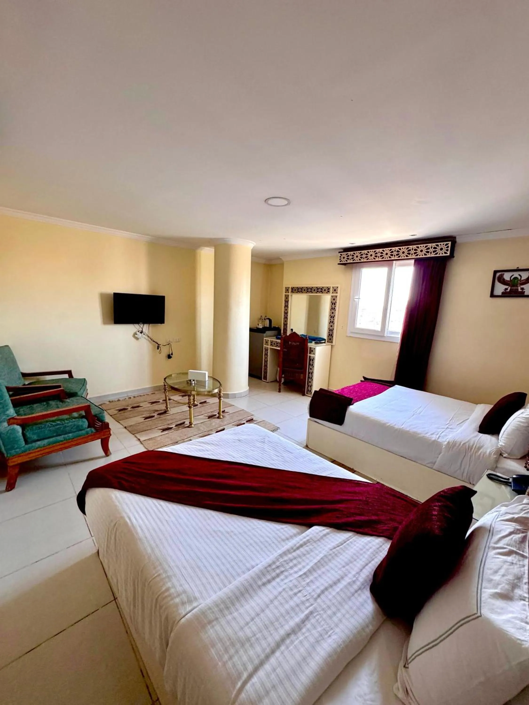 Communal lounge/ TV room, Bed in PYRAMIDS TOWER Inn