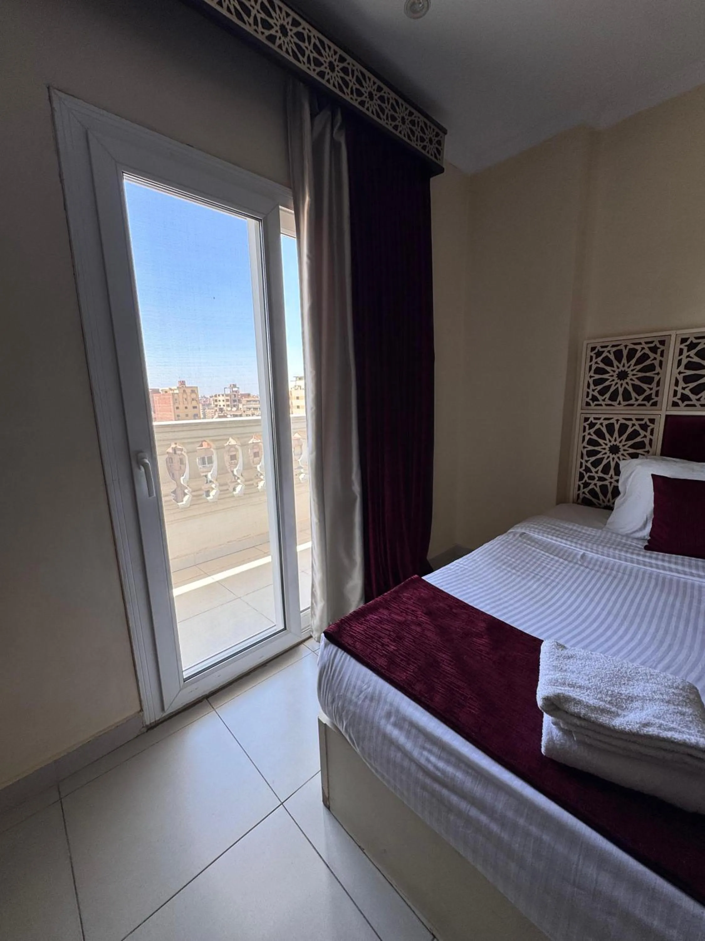 Bed in PYRAMIDS TOWER Inn