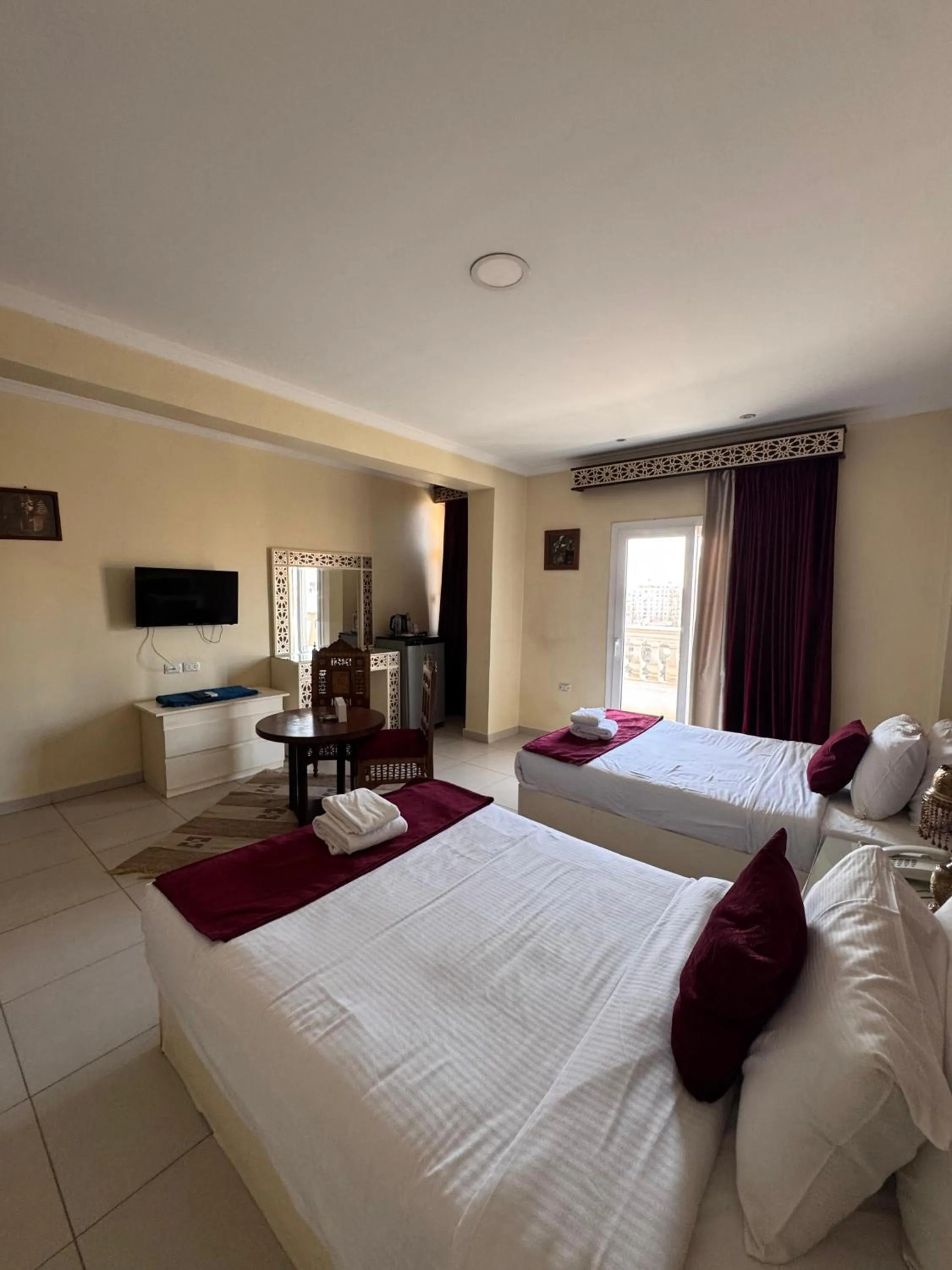 Communal lounge/ TV room, Bed in PYRAMIDS TOWER Inn