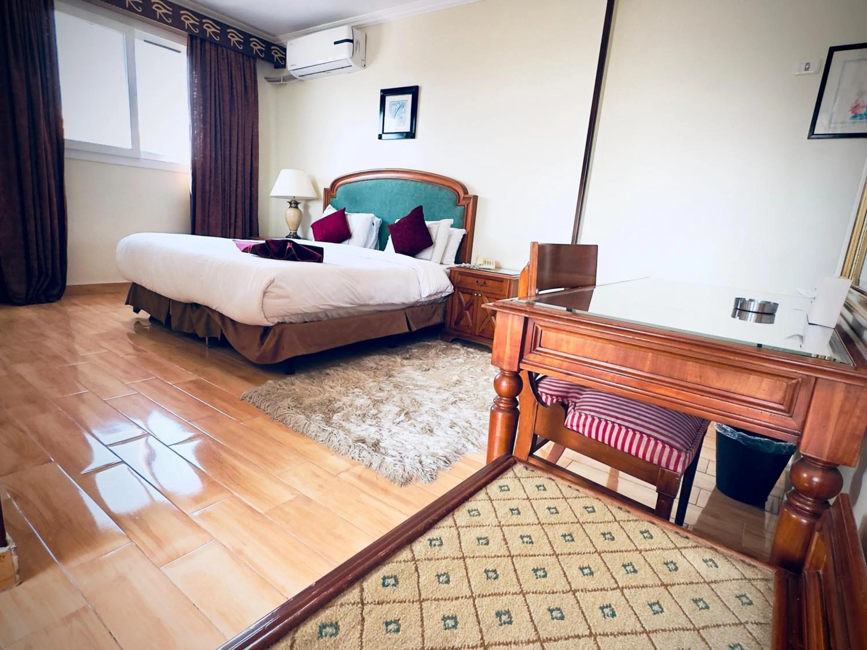 Bed in PYRAMIDS TOWER Inn