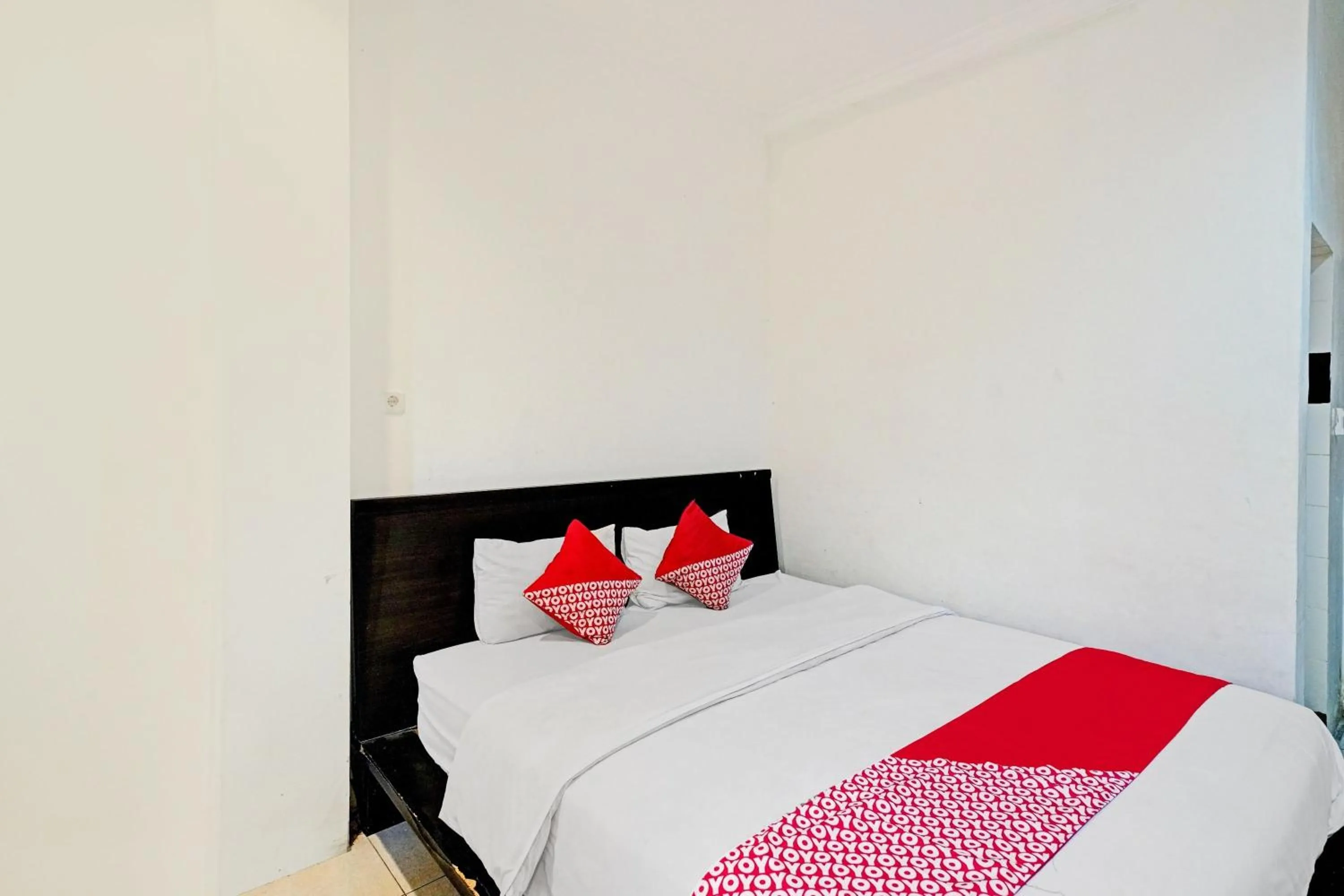 Bedroom in OYO 90450 Sentra Inn