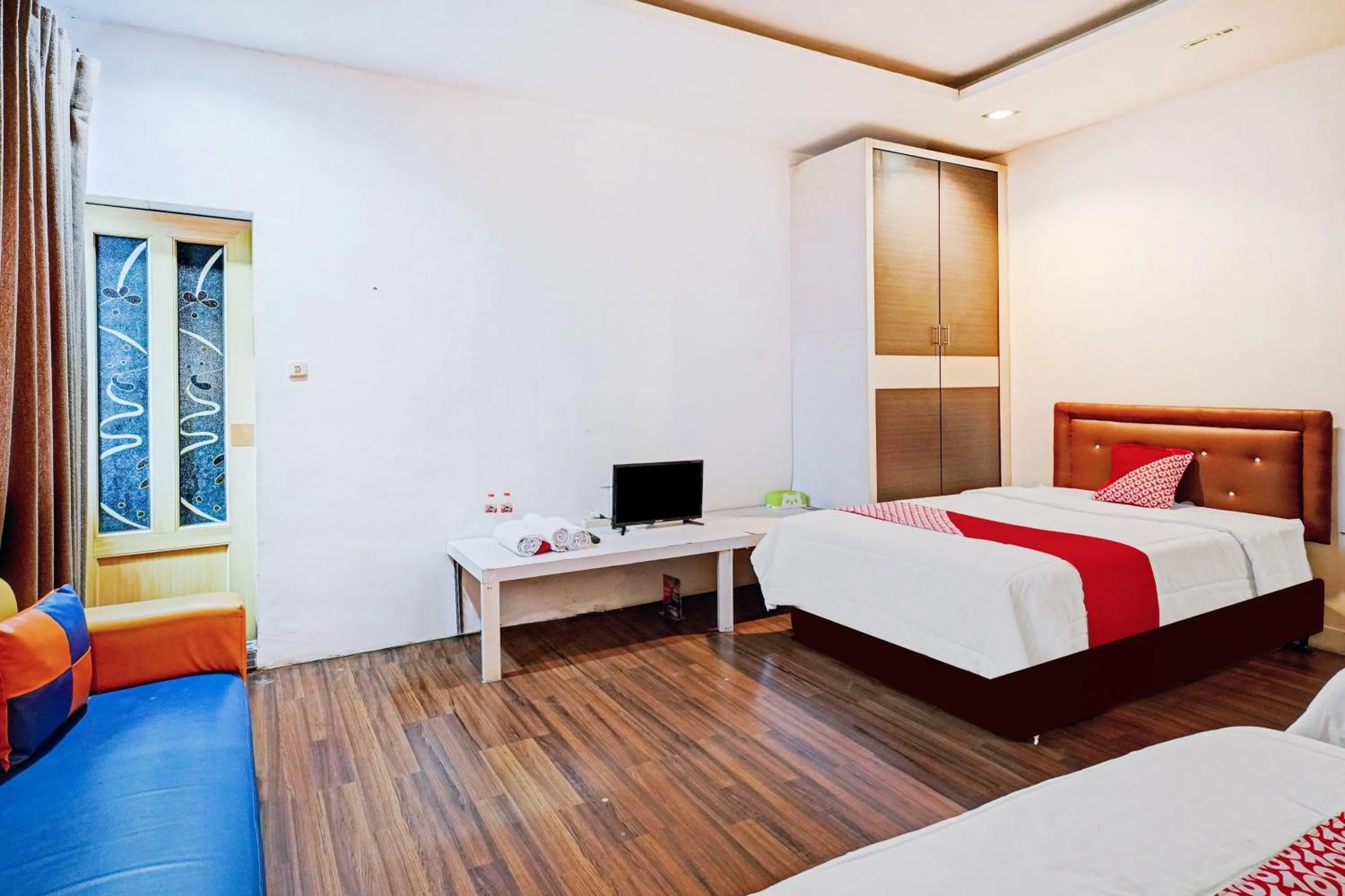 Bedroom in OYO 90450 Sentra Inn