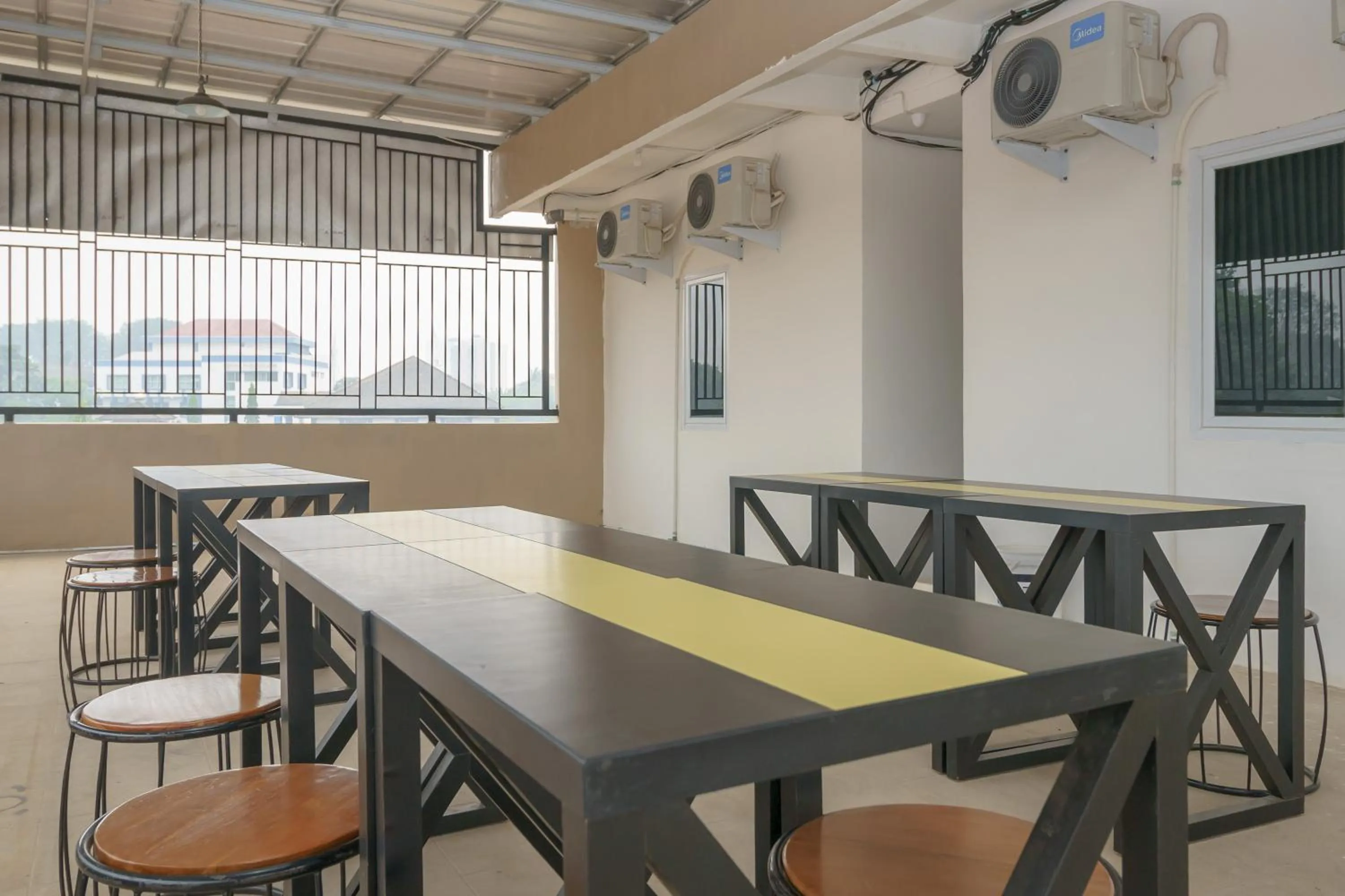 Seating area in RedDoorz Plus at Grand Tara Homestay Palembang