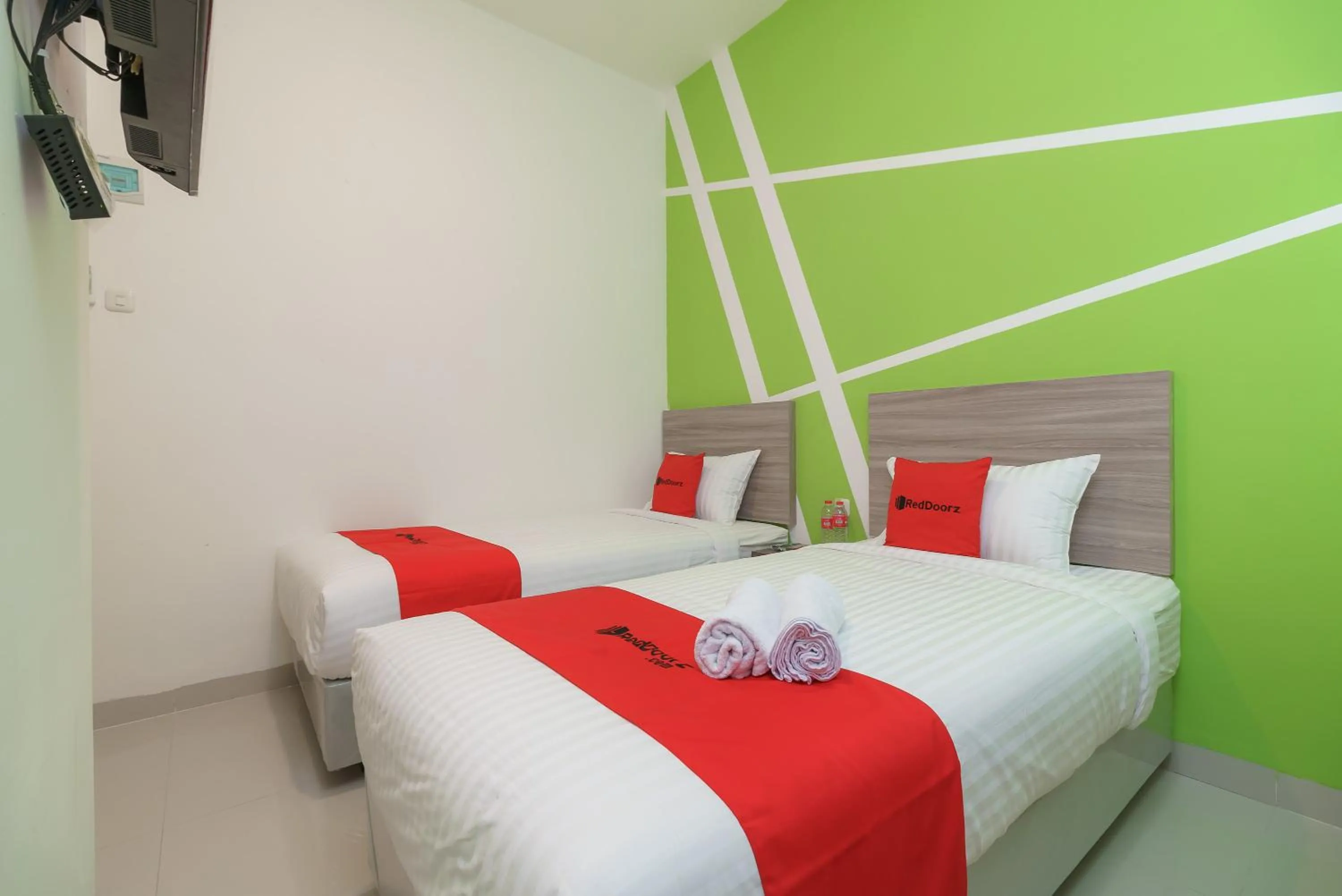 Bedroom, Bed in RedDoorz Plus at Grand Tara Homestay Palembang