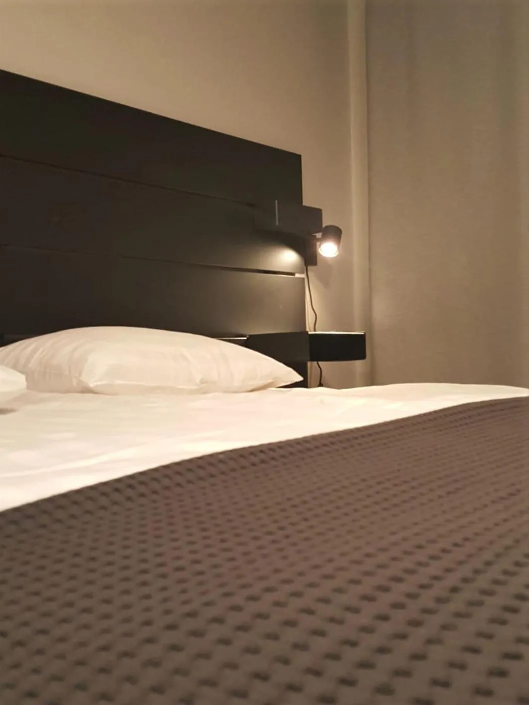 Bed in Koto Hotel Pihtipudas