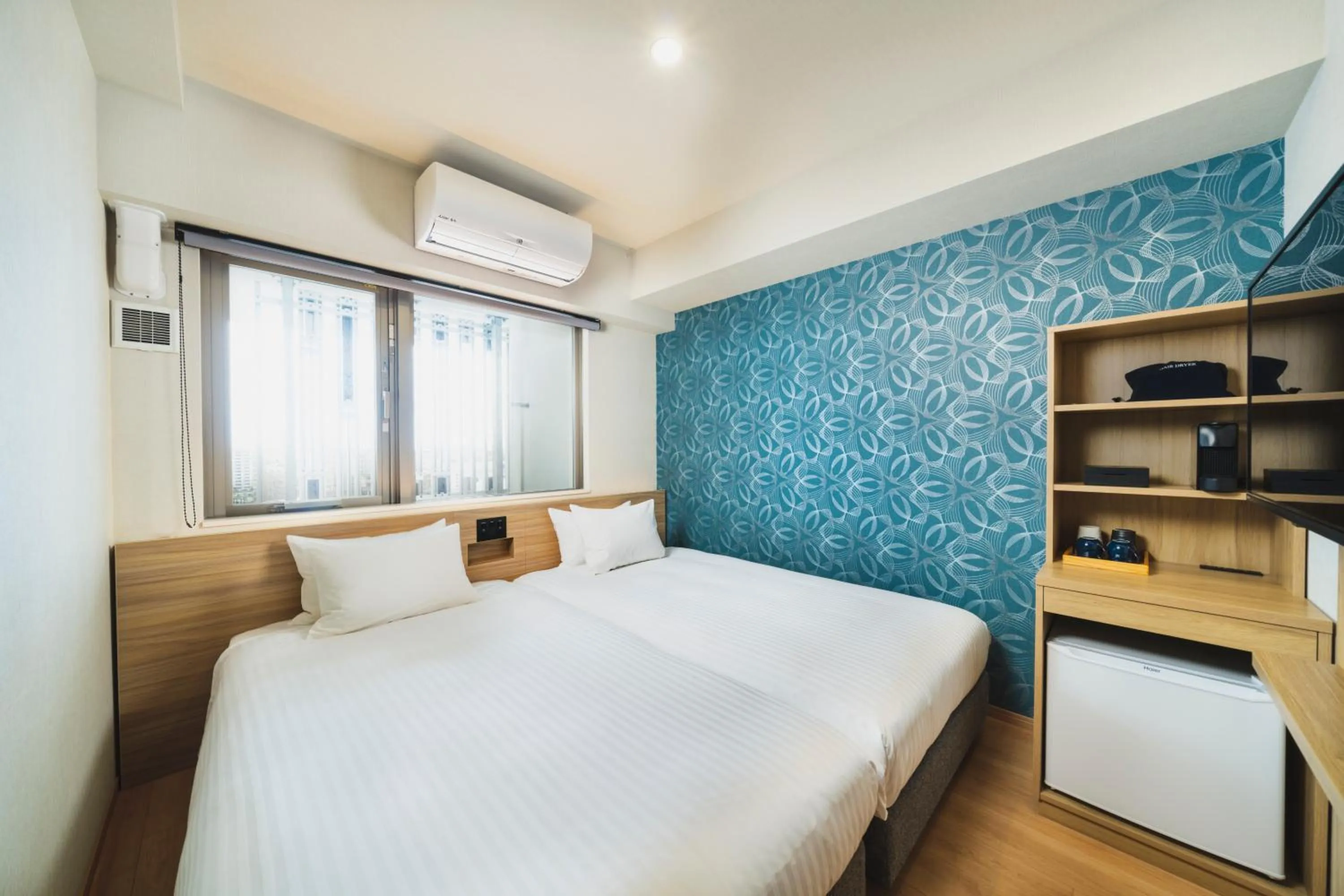 Bed in HOTEL SANSUI NAHA Ryukyu Onsen Naminoue-No-Yu