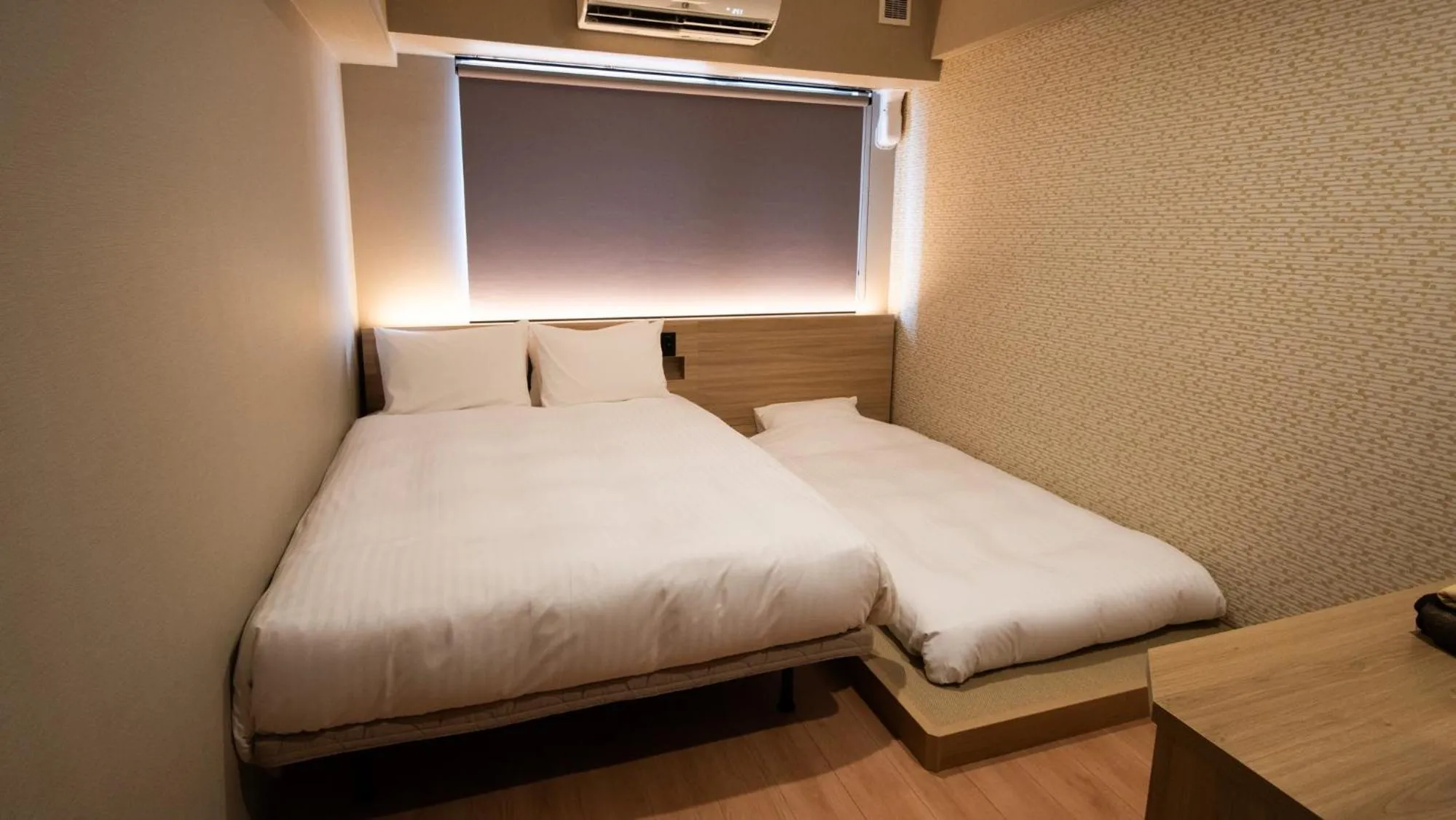 Bed in HOTEL SANSUI NAHA Ryukyu Onsen Naminoue-No-Yu