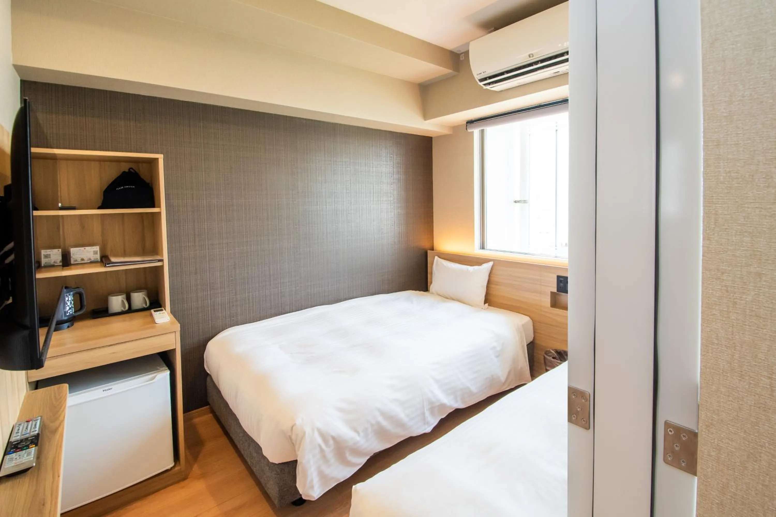 Bedroom, Bed in HOTEL SANSUI NAHA Ryukyu Onsen Naminoue-No-Yu