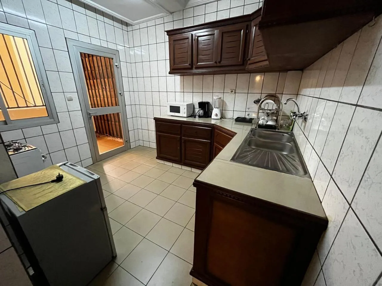kitchen in Résidences hôtelières Micheline et Emile BASTOS