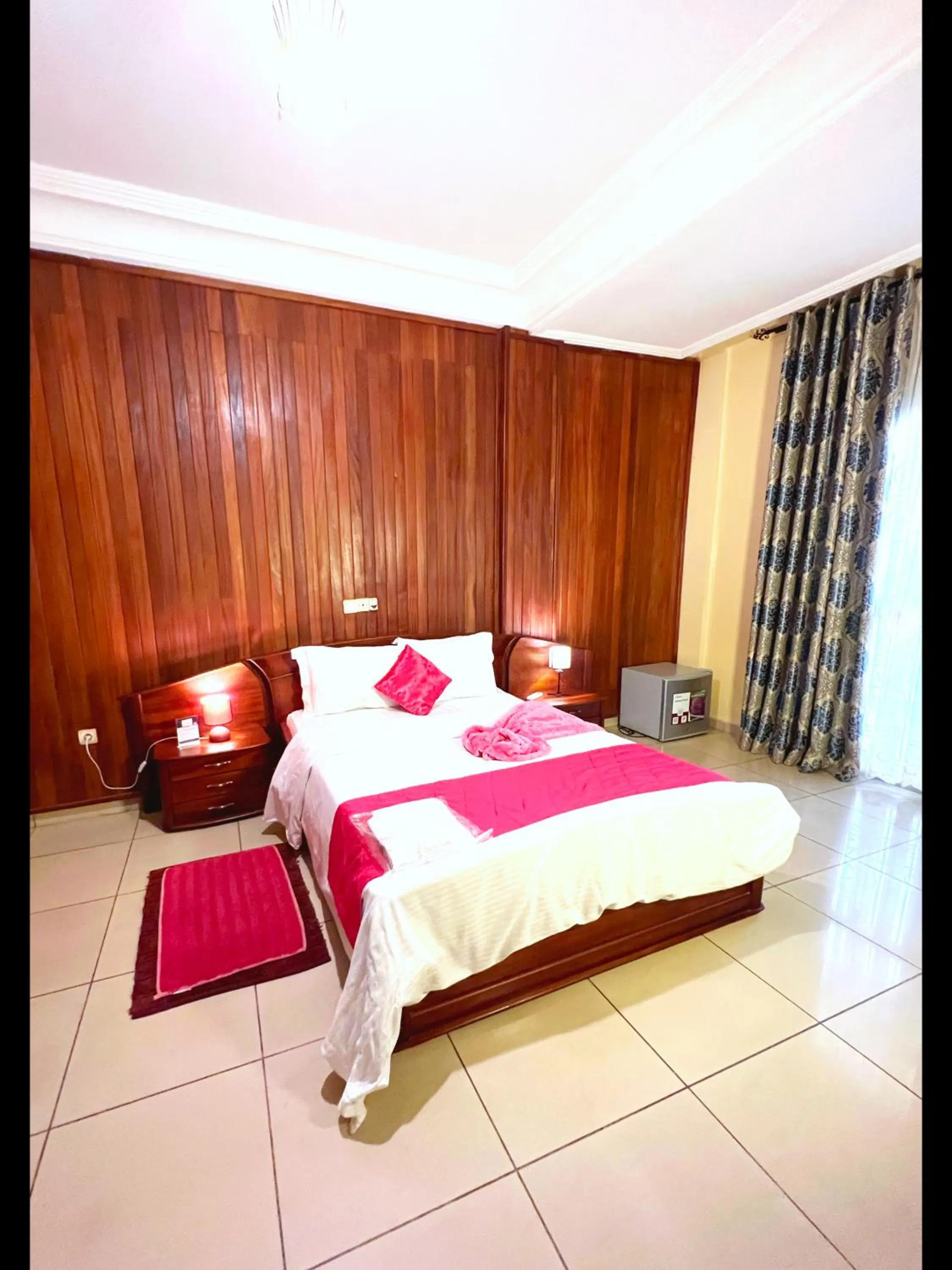 Bed in Résidences hôtelières Micheline et Emile BASTOS