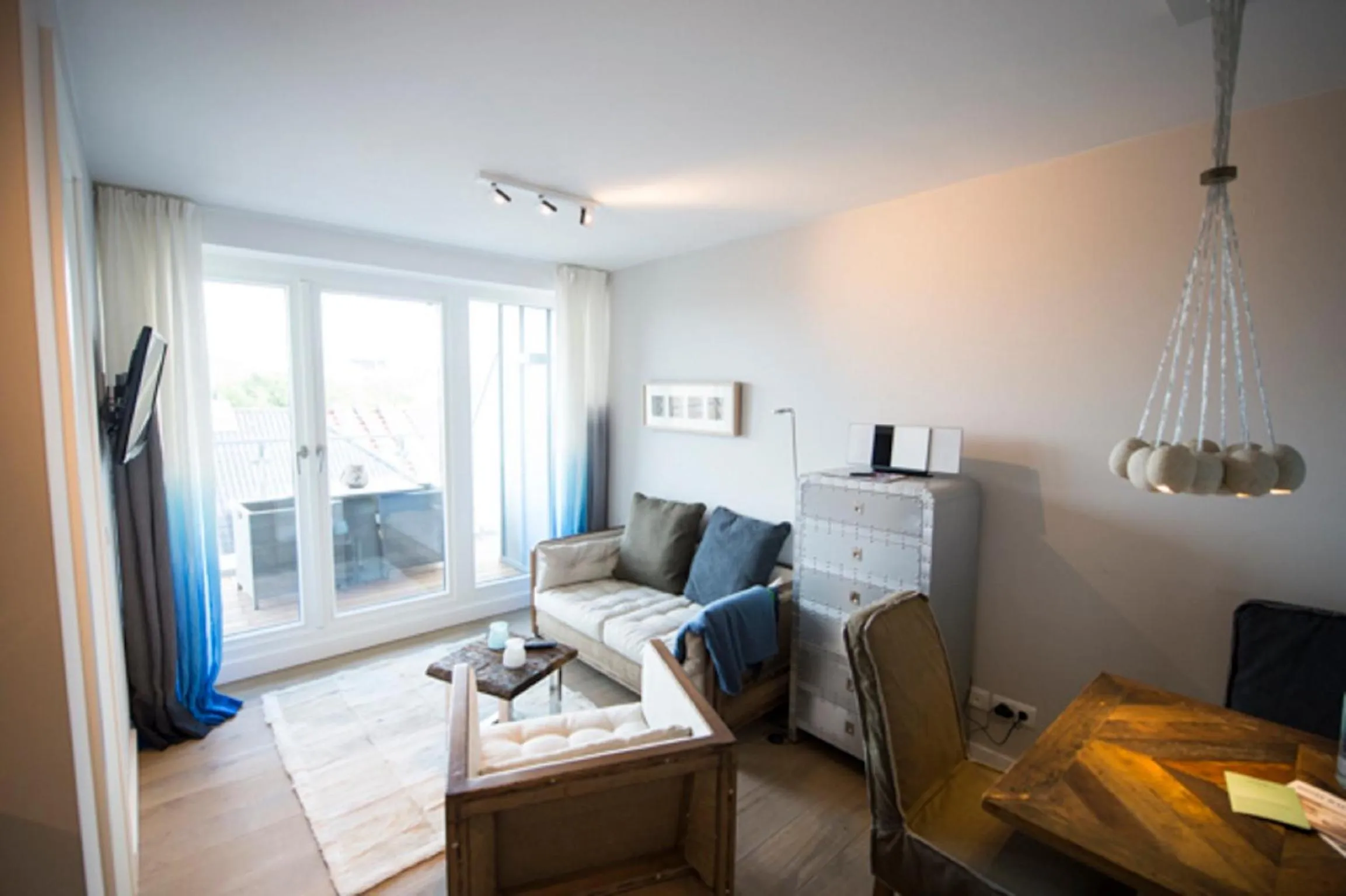 Living room, Bed in Das 54 Grad Nord - Apartments & More