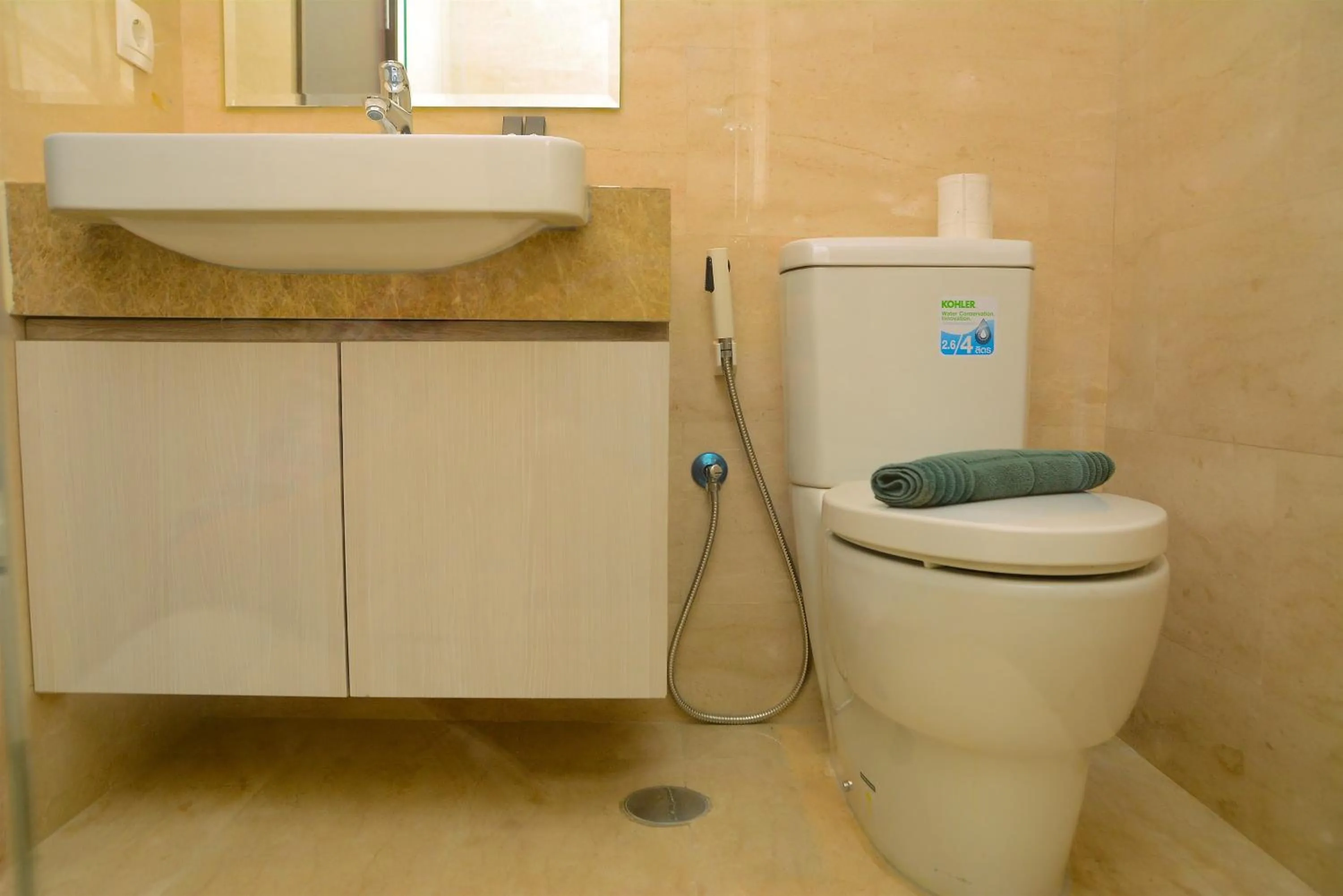 Bathroom in Tranquil Studio Apartment at Menteng Park By Travelio