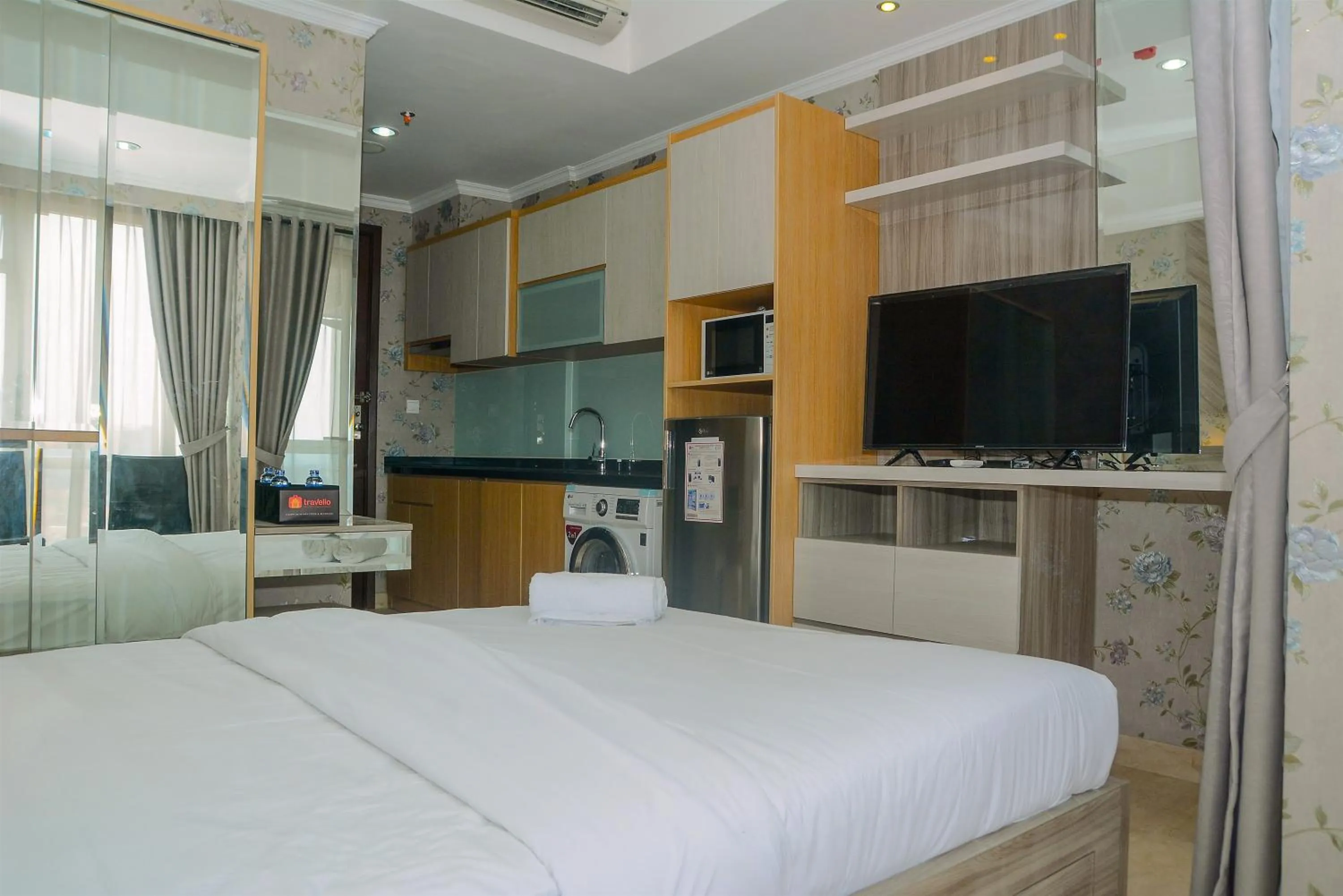 Bed in Tranquil Studio Apartment at Menteng Park By Travelio