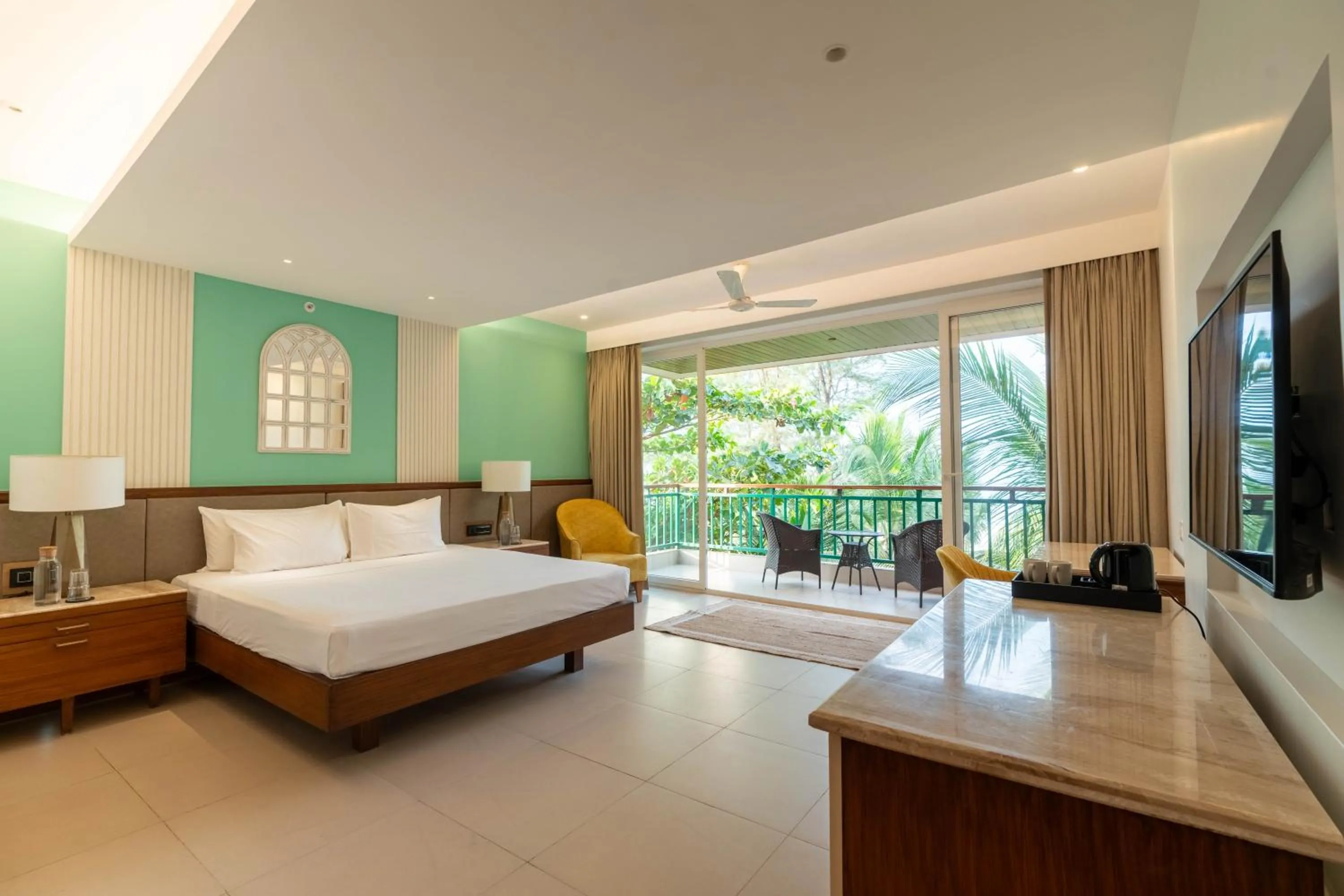 Bed in Mandrem Beach Resort, a member of Radisson Individuals Retreat