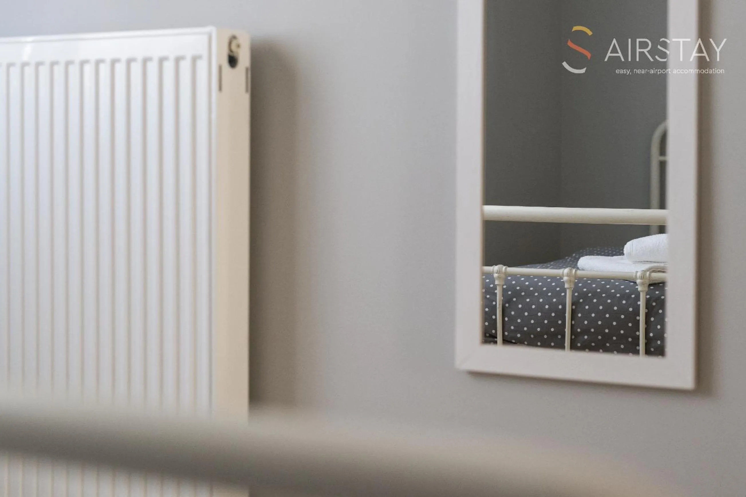 Bed in Elise Apartment Airport by Airstay