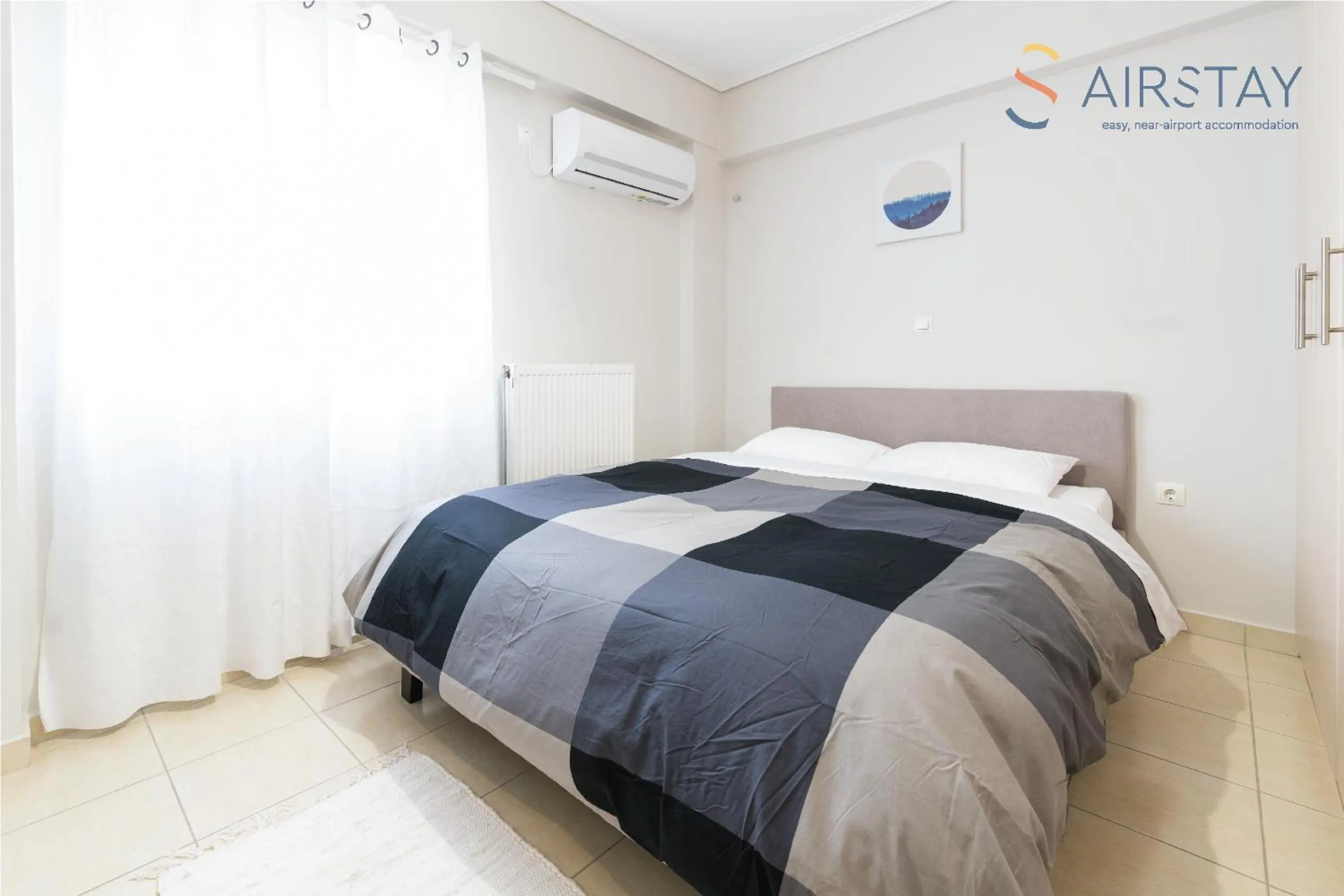 Bed in Elise Apartment Airport by Airstay
