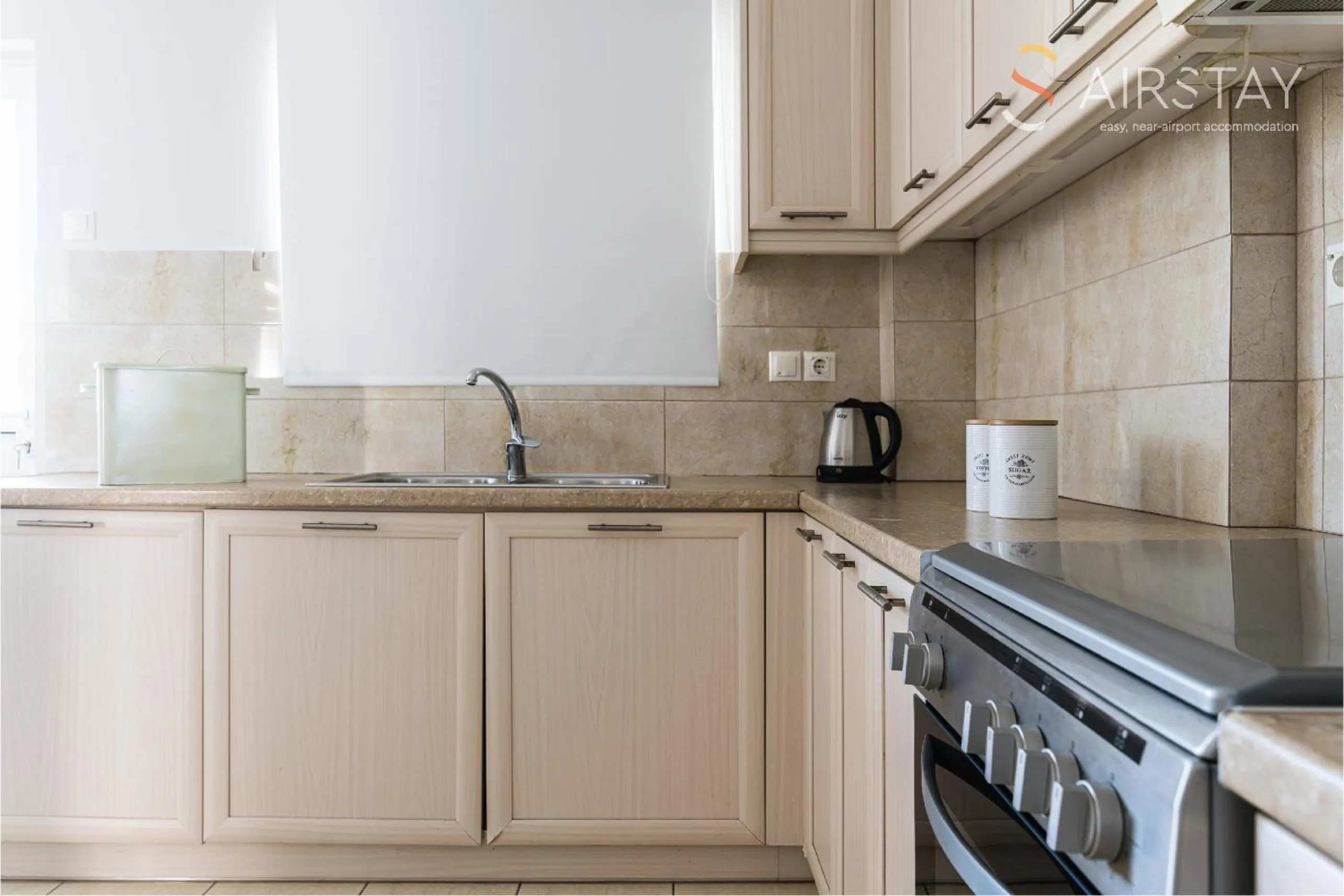 kitchen in Elise Apartment Airport by Airstay